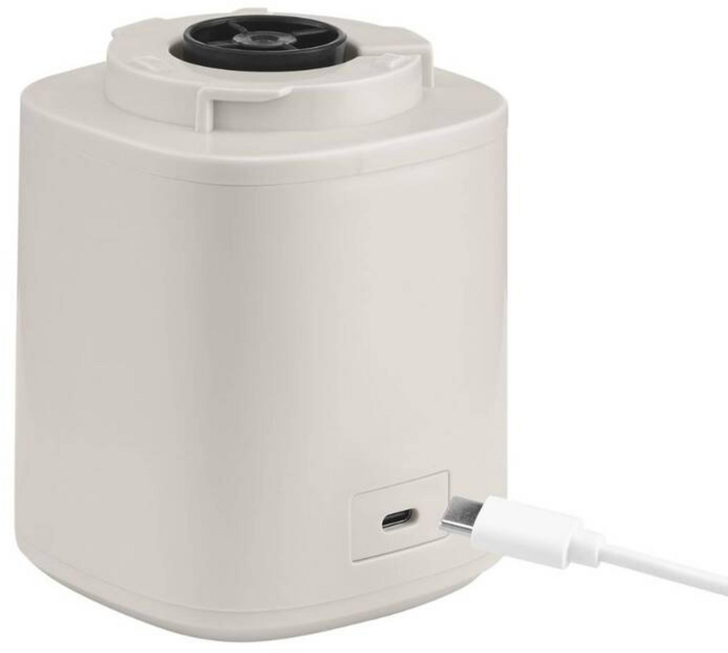 Ein weißes Gerät mit schwarzer Oberseite und einem USB-C-Kabel.