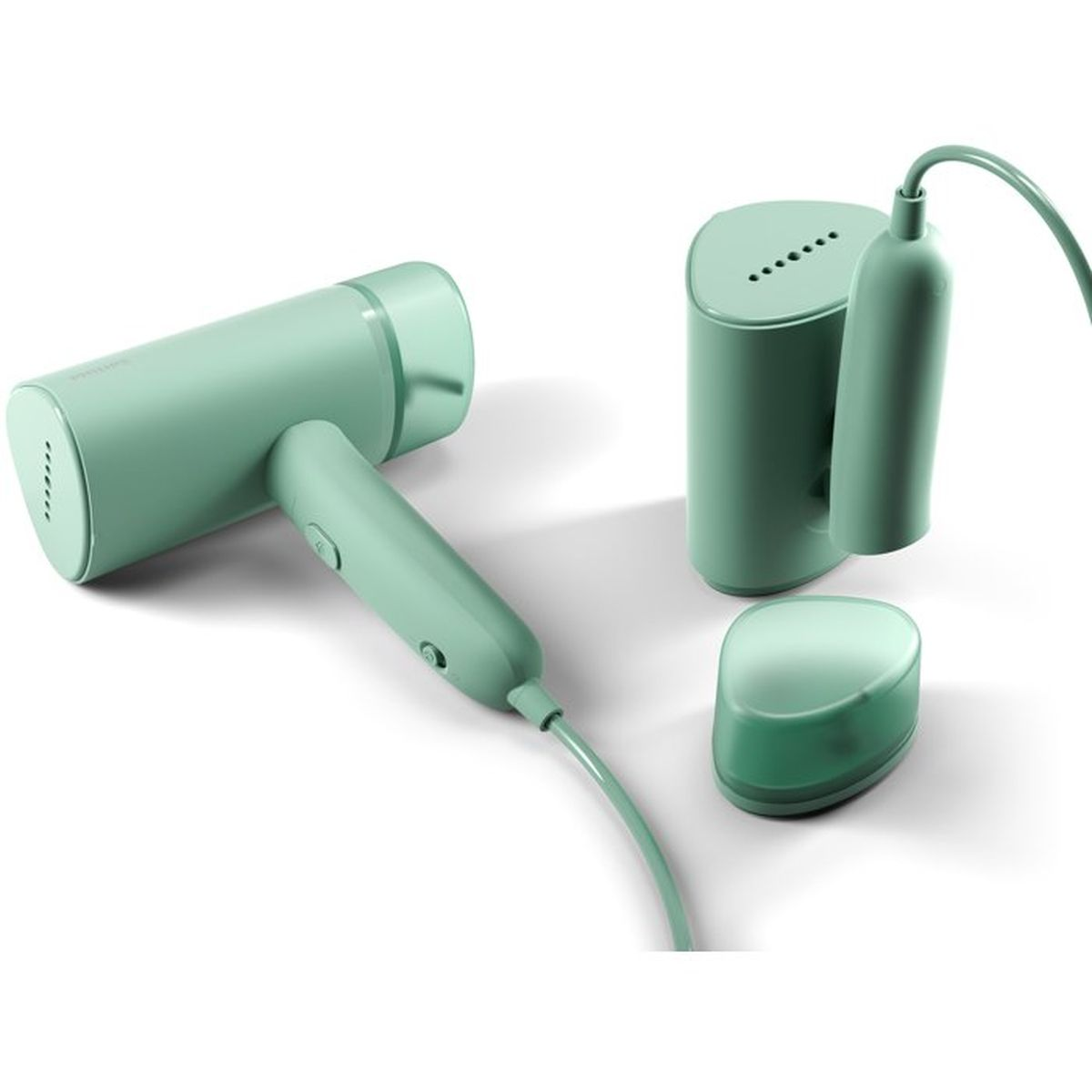 Miętowo-zielona parownica do ubrań i akcesoria na białym tle.