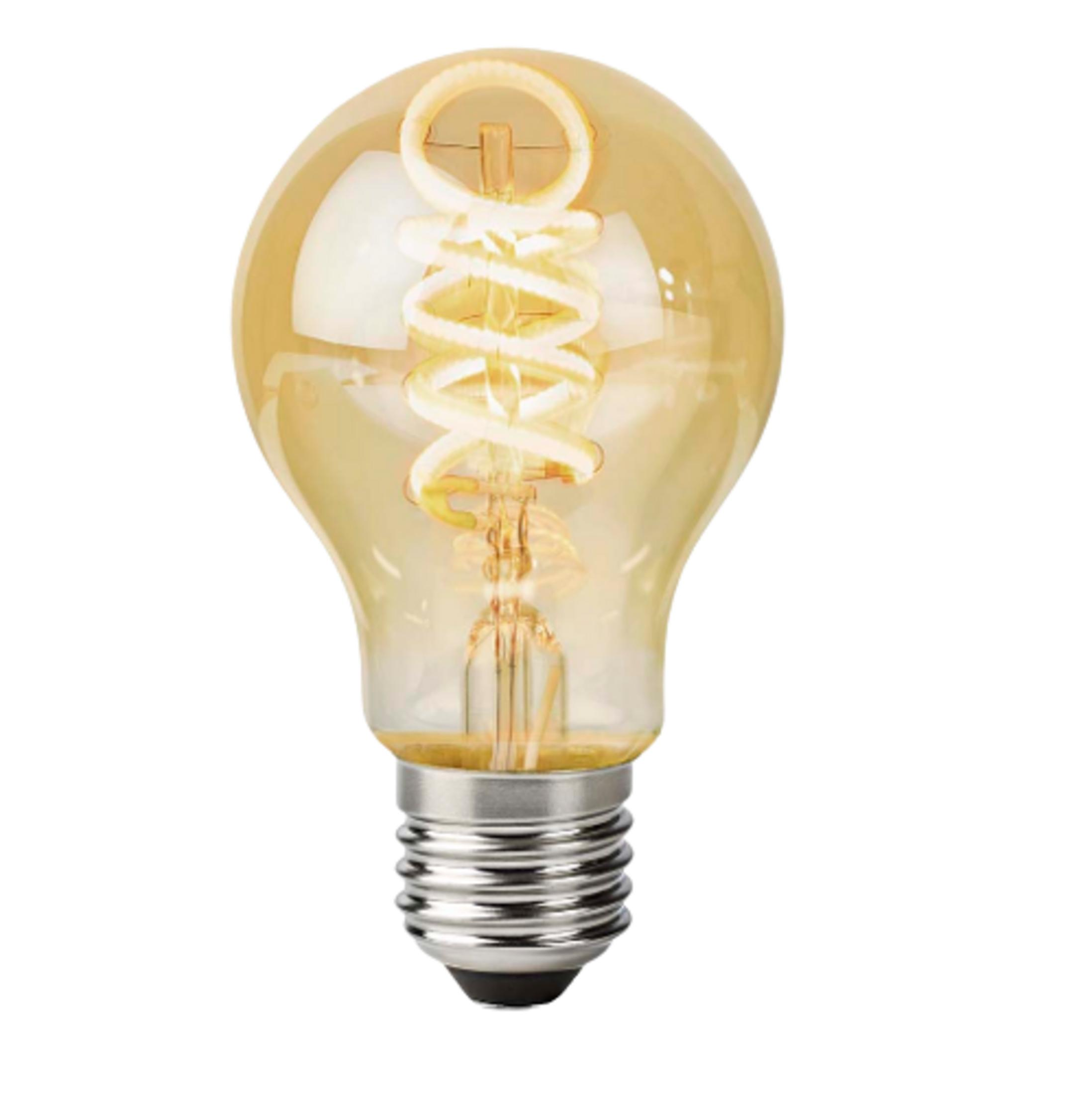 Złota bursztynowa żarówka z filamentem spiralnym i metalową podstawą.