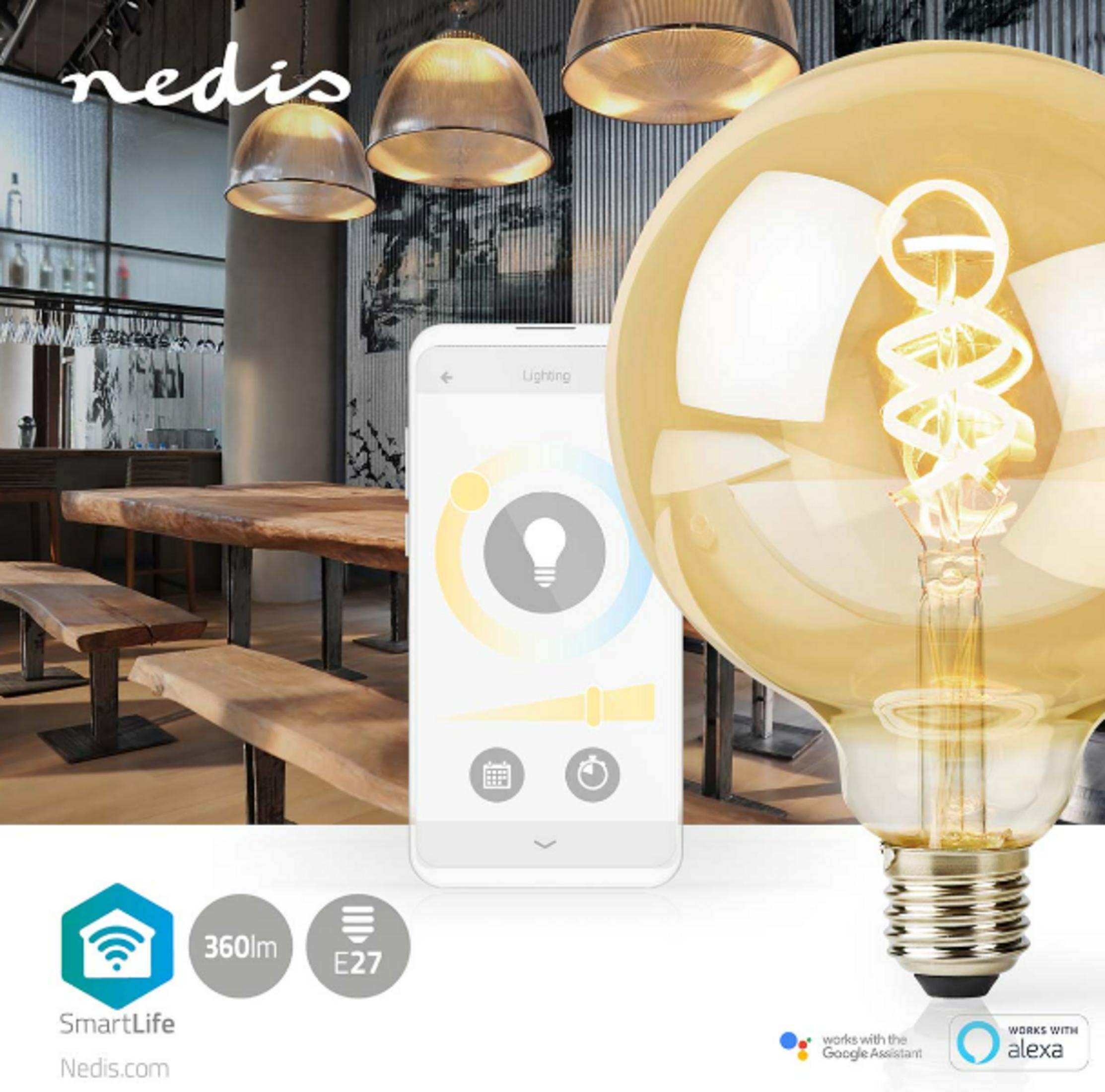 Duża żarówka Edisona z widocznym żarnikiem obok smartfona wyświetlającego sterowanie oświetleniem.