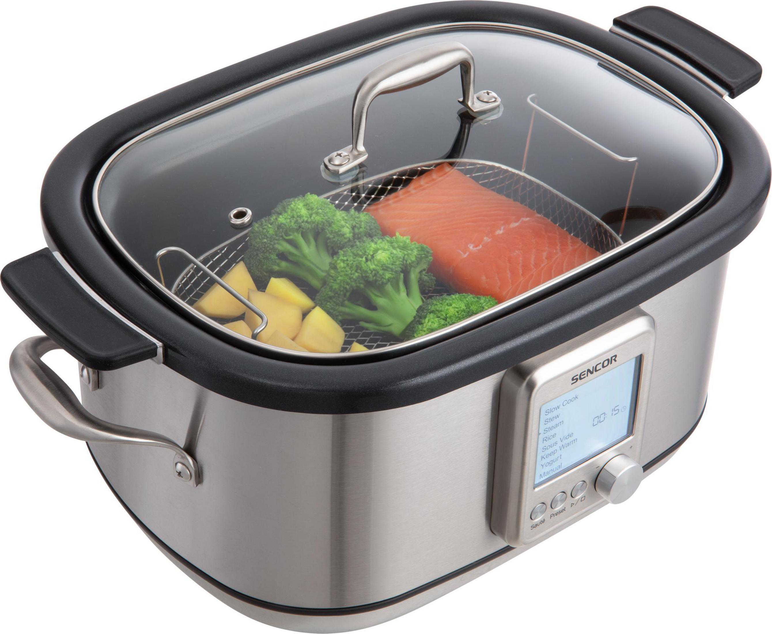 Una slow cooker argentata con coperchio in vetro, contenente salmone, broccoli e patate.