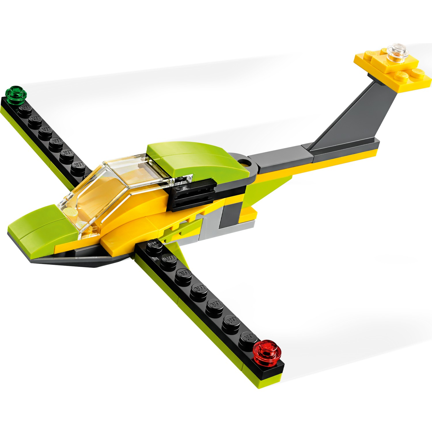 Żółto-zielony samolot Lego z przezroczystym kokpitem i czarnymi końcówkami skrzydeł.