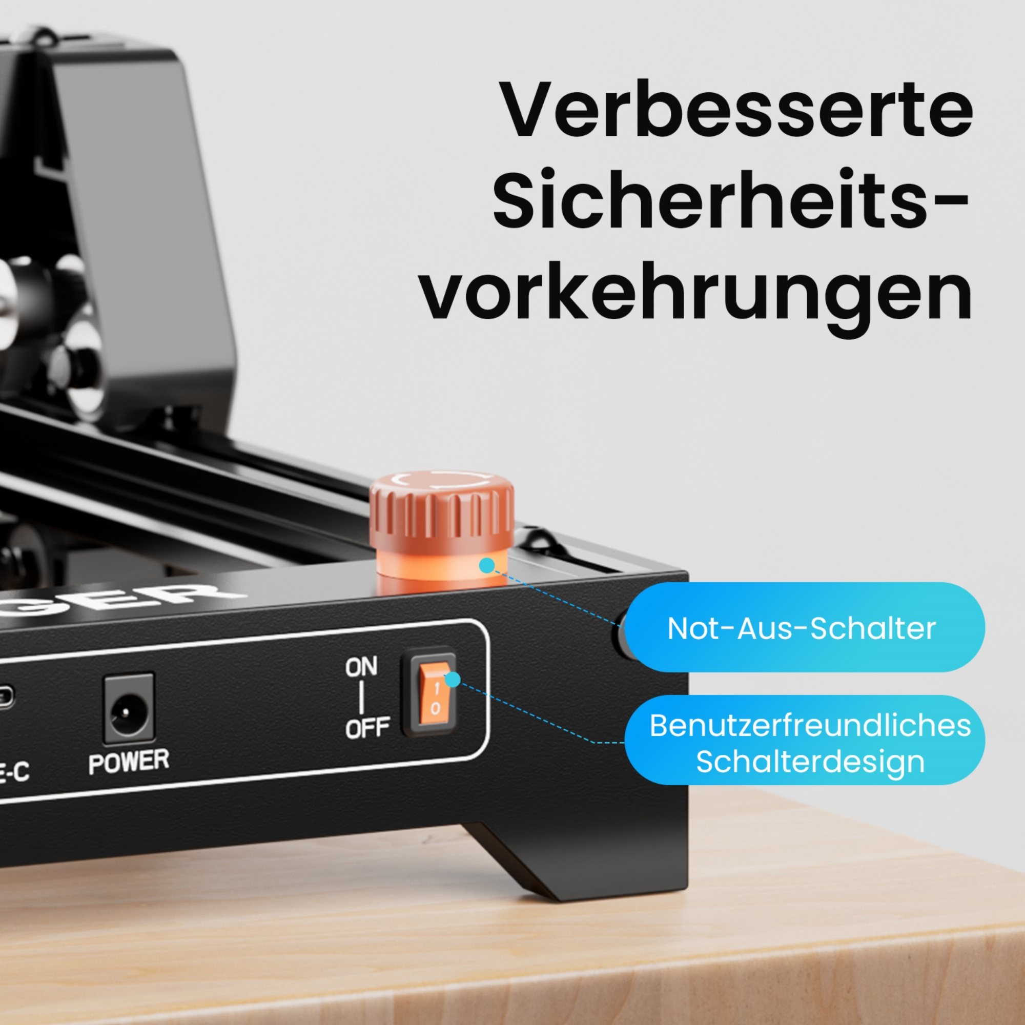 Ein schwarzes Gerät mit orangefarbenem Knopf und Schalter, Text über Sicherheit.