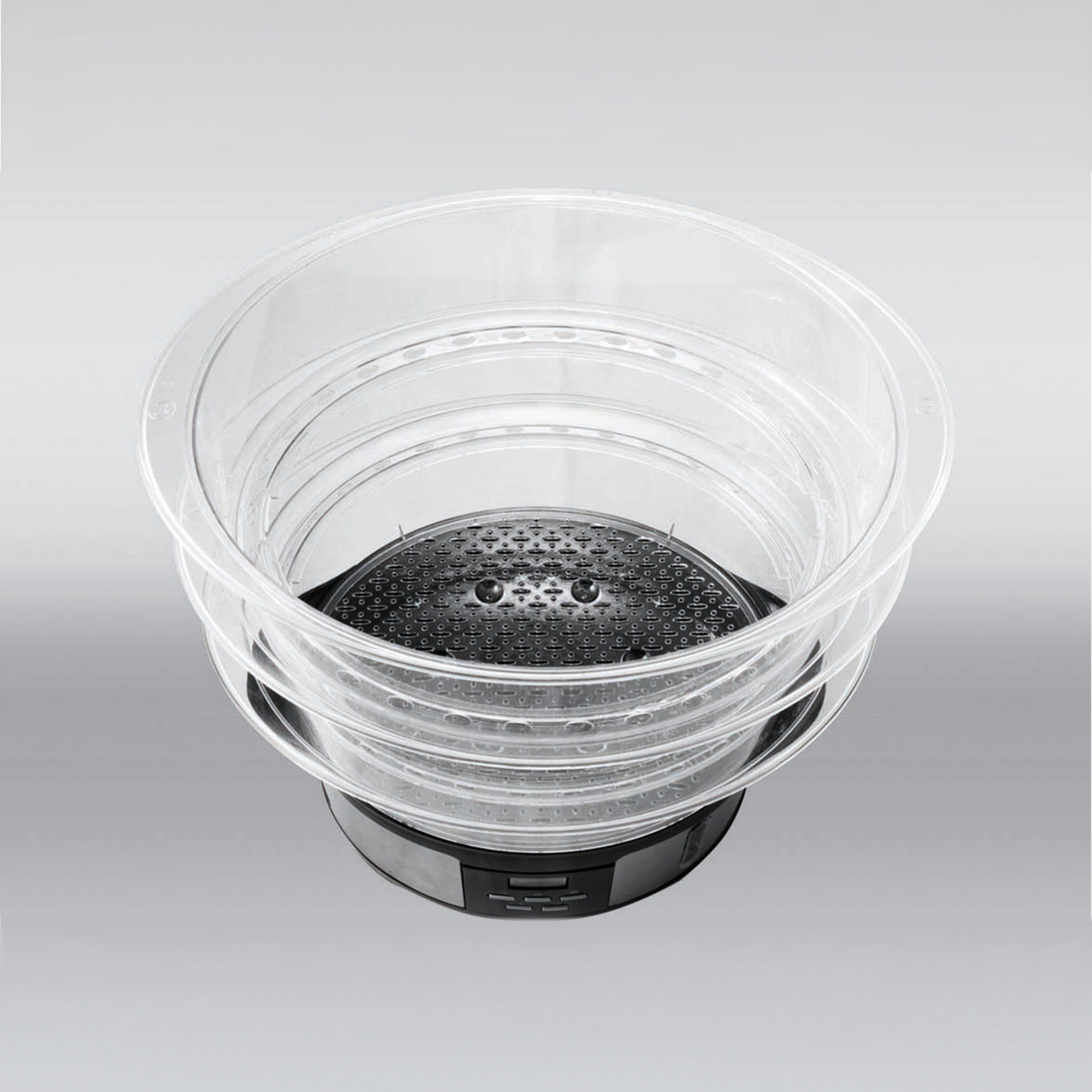 A clear steamer basket with a black insert and control panel.