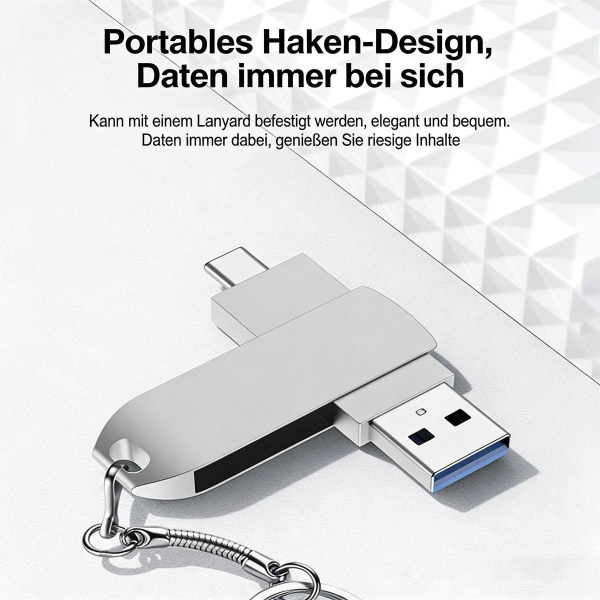 Ein silberner USB-Stick mit Haken und doppeltem Anschluss (USB-A & USB-C).