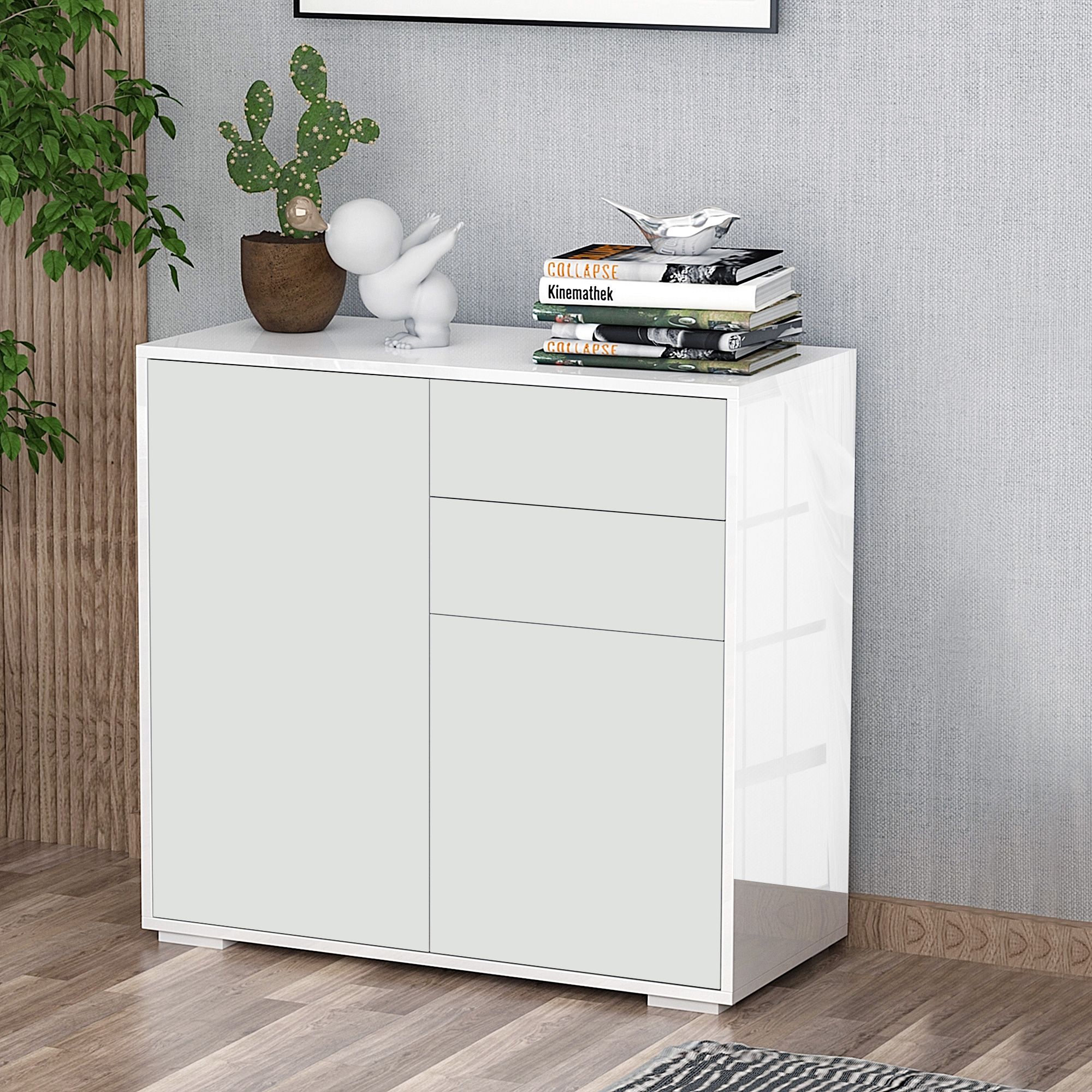 Un mueble blanco con puertas verde claro, adornado con libros, un cactus en maceta y una escultura.