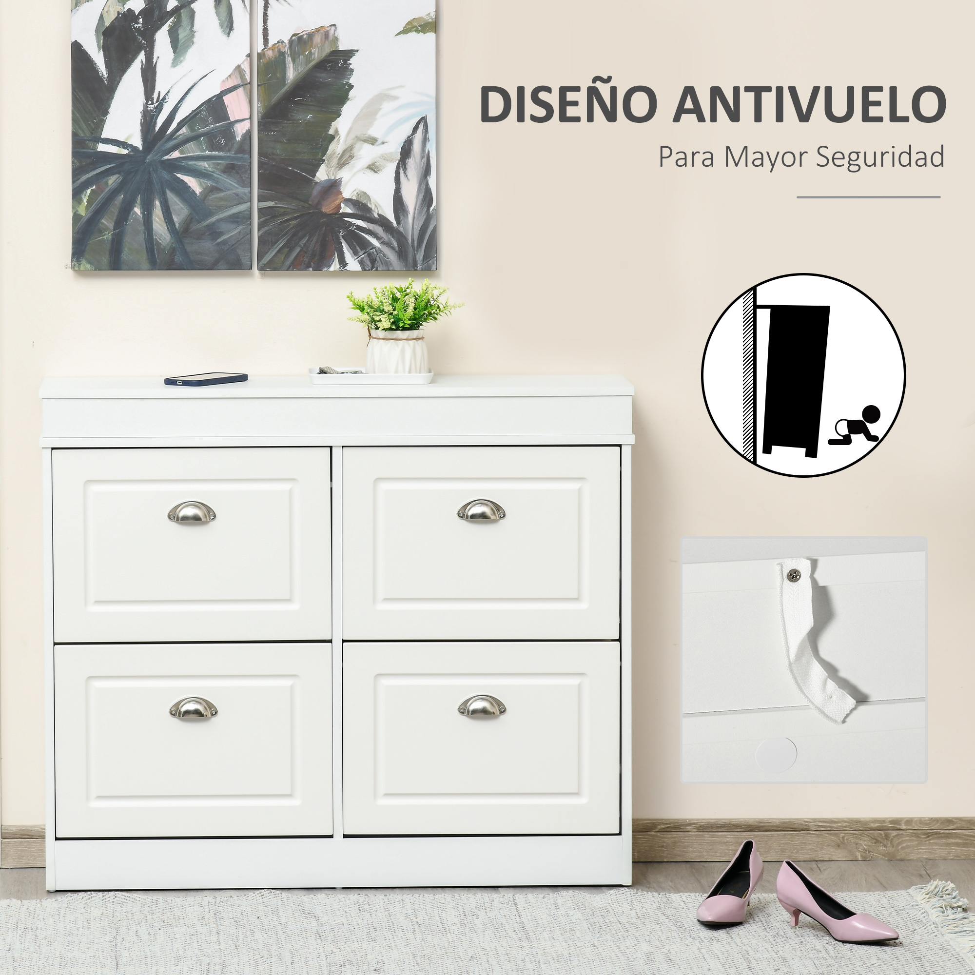 Un zapatero blanco con cuatro cajones, dos cuadros y una planta en maceta.