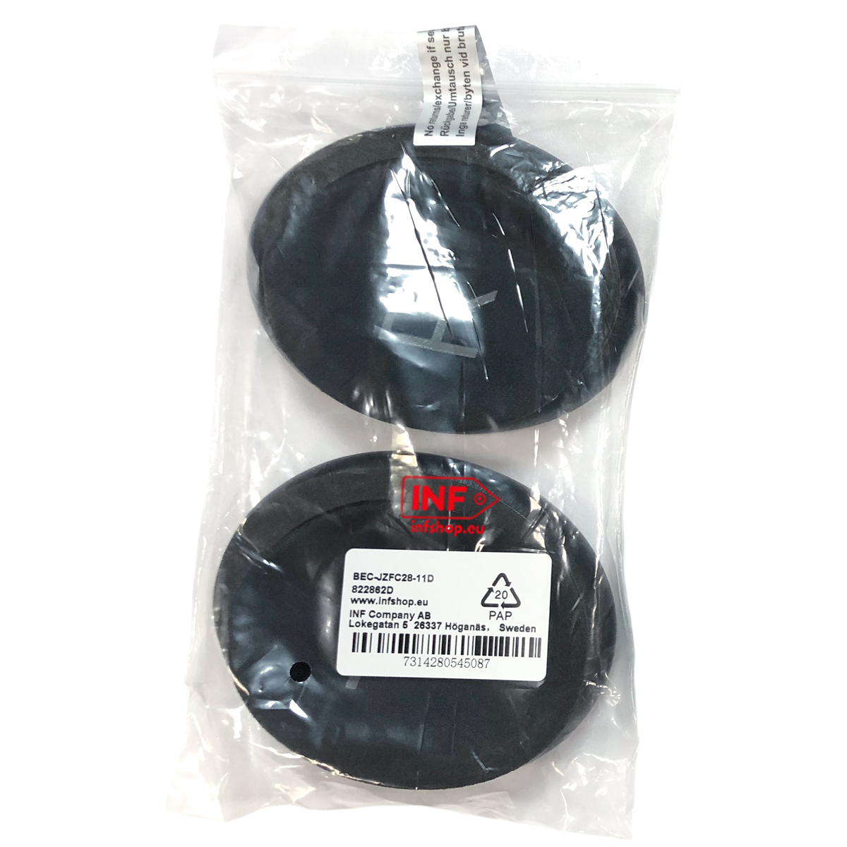 Dwa czarne okrągłe przedmioty w plastikowym opakowaniu z etykietą.