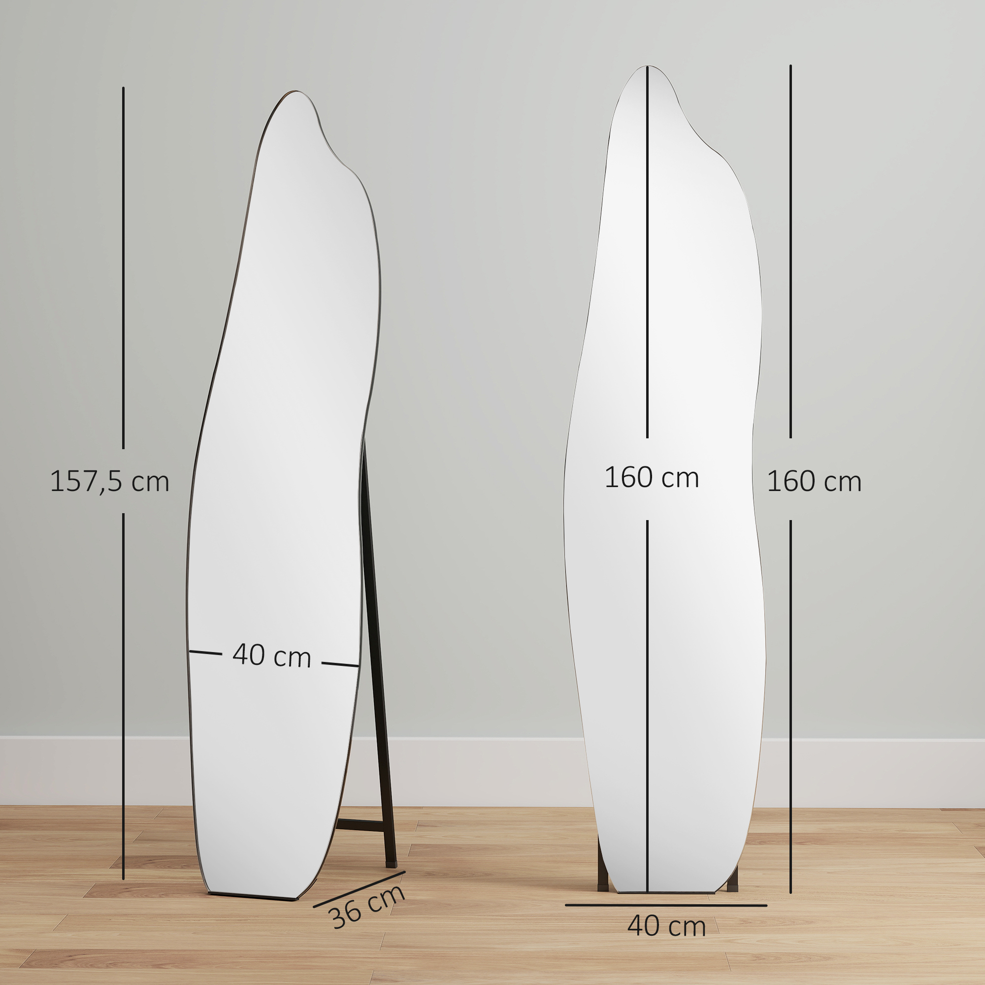 Dos espejos de forma irregular sobre un suelo de madera contra una pared gris claro.