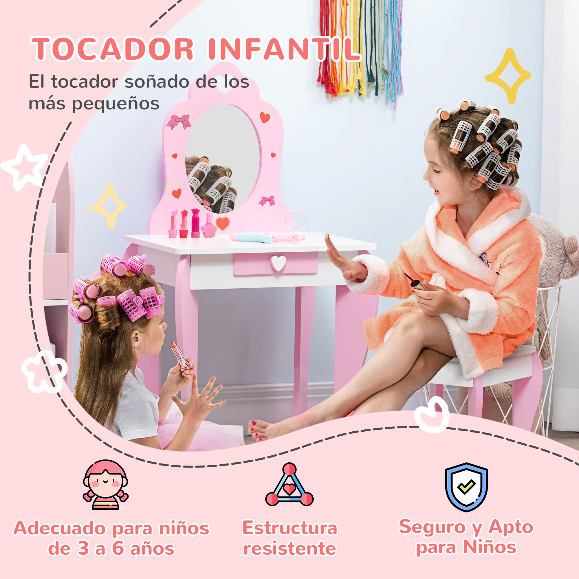 Dos niñas con rulos juegan en un tocador rosa.