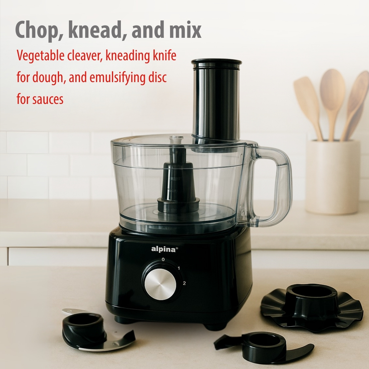 Black Alpina food processor with attachments on a counter. Includes cleaver, kneading knife, and emulsifying disc.