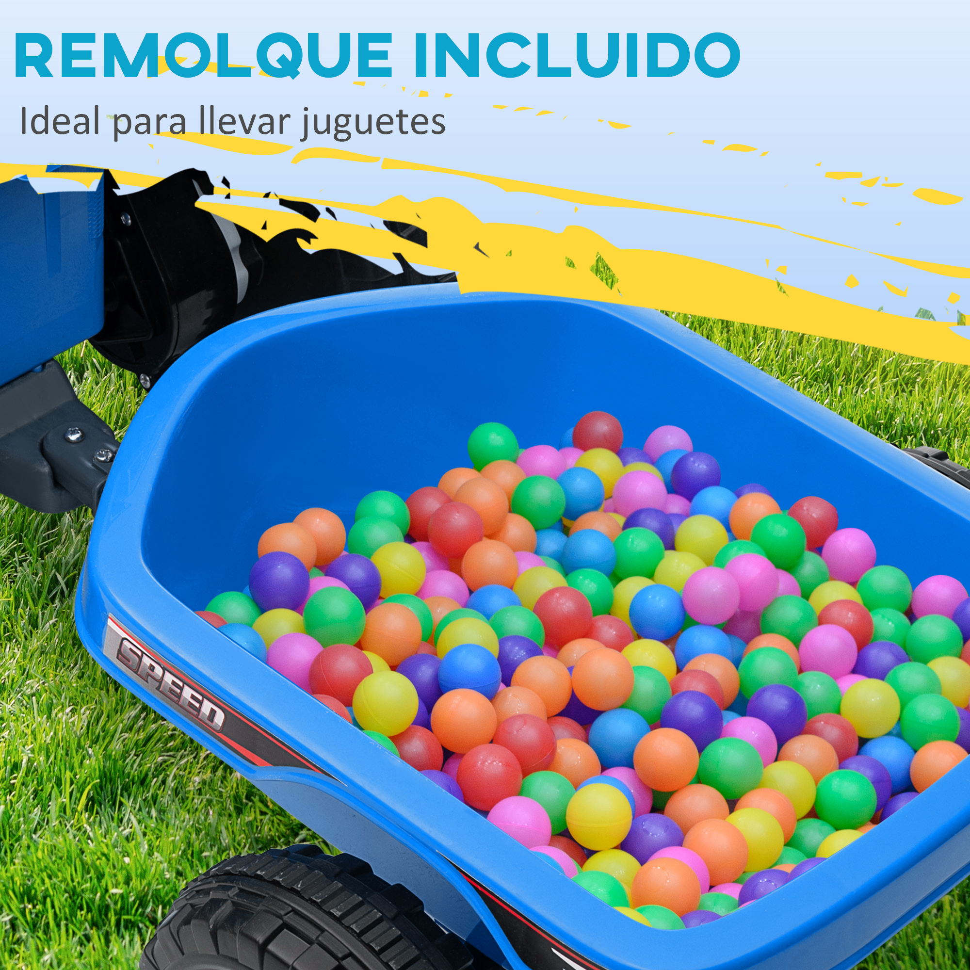 Un carro azul lleno de pelotas de colores sobre hierba verde.