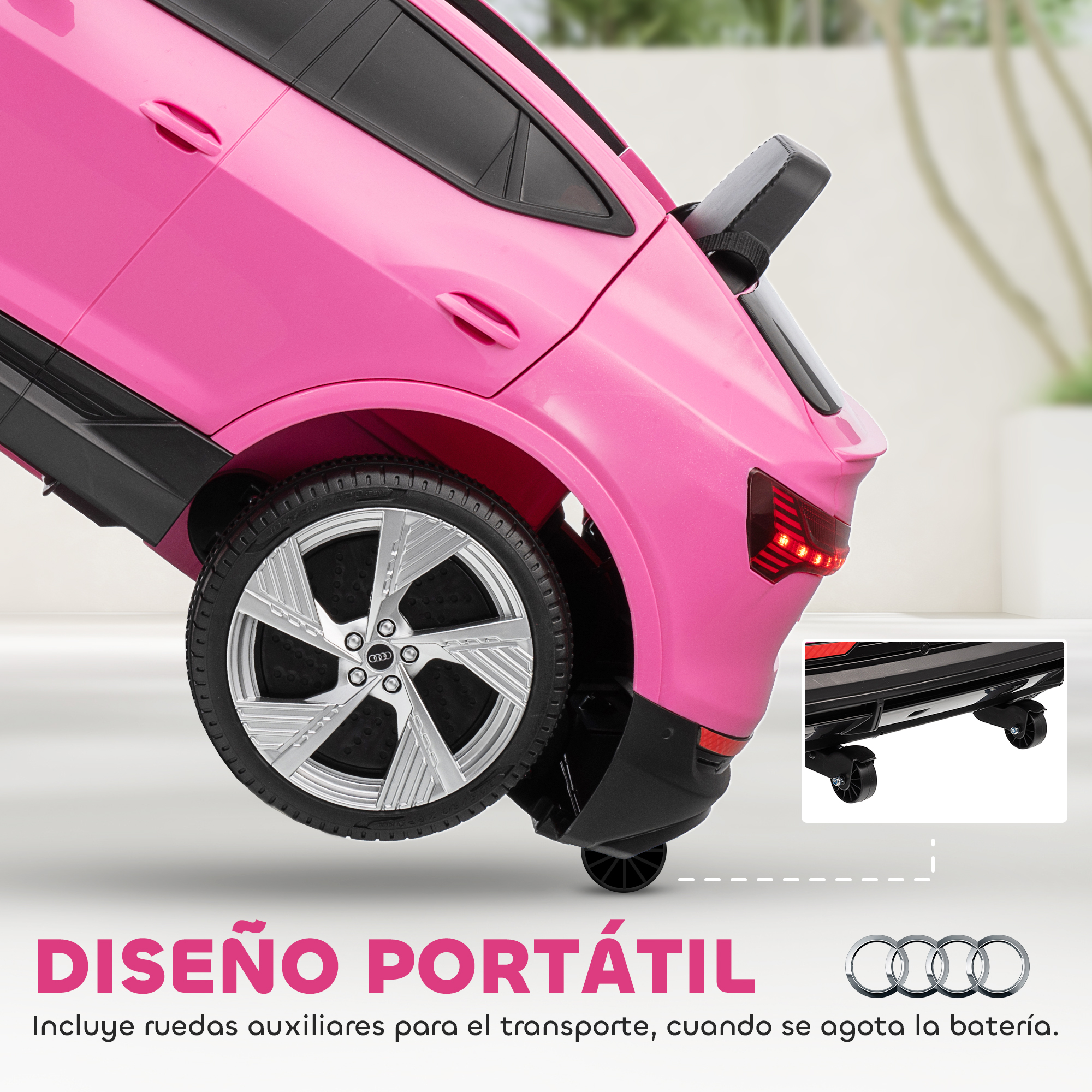 Un coche de juguete rosa con ruedas plateadas y pequeñas ruedas de transporte.