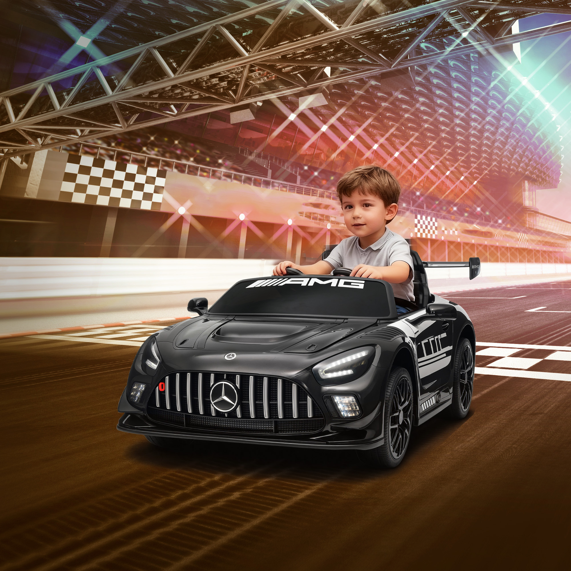 Un niño conduce un coche de juguete negro en una pista de carreras con bandera a cuadros y luces.