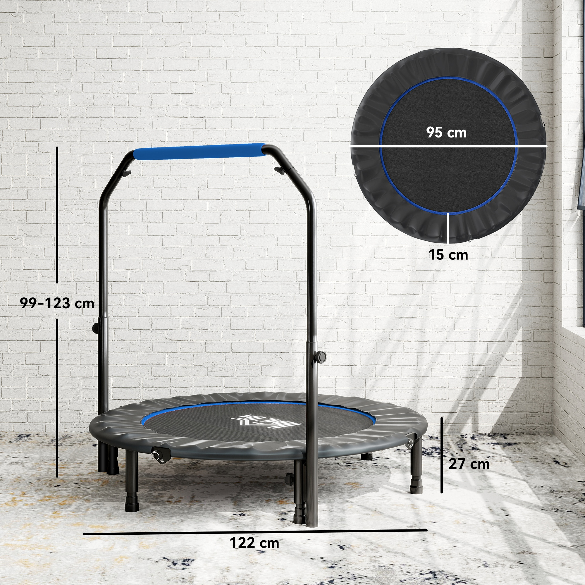 Trampolín negro con borde azul, asa y medidas. Sobre alfombra.
