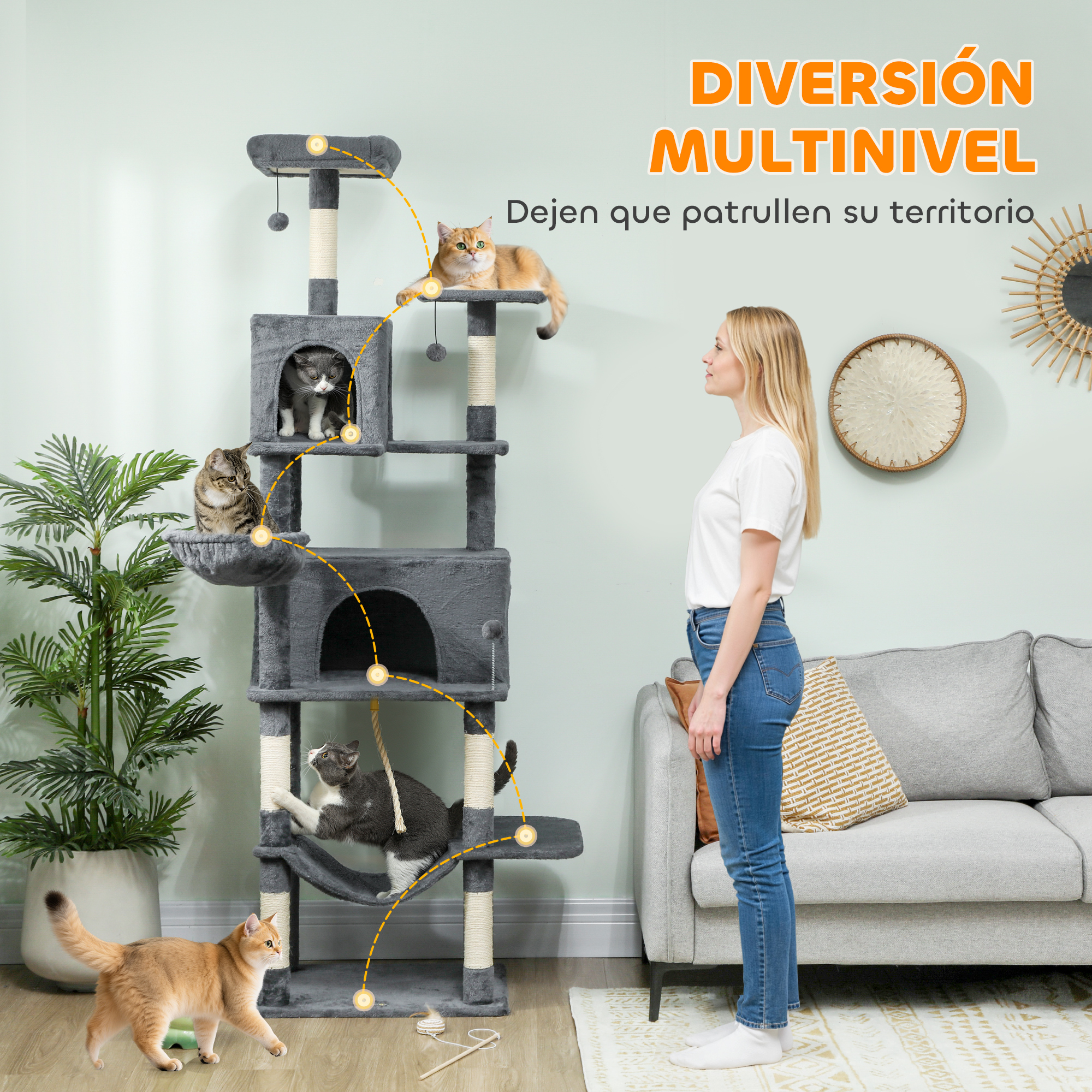 Un gran árbol para gatos gris de varios niveles con cuatro gatos jugando y descansando.