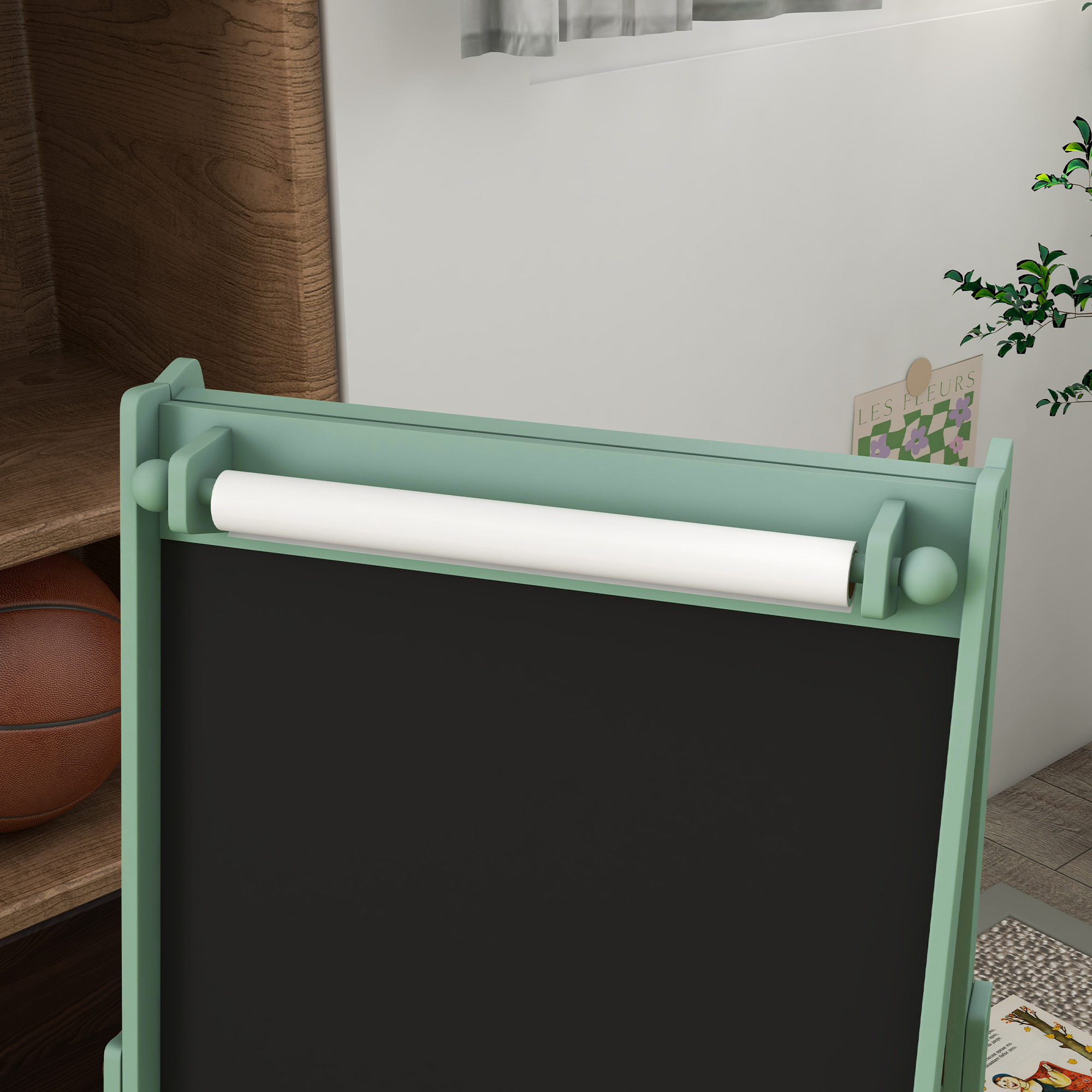 Caballlete verde con rollo de papel y pizarra, al lado una pelota de baloncesto.