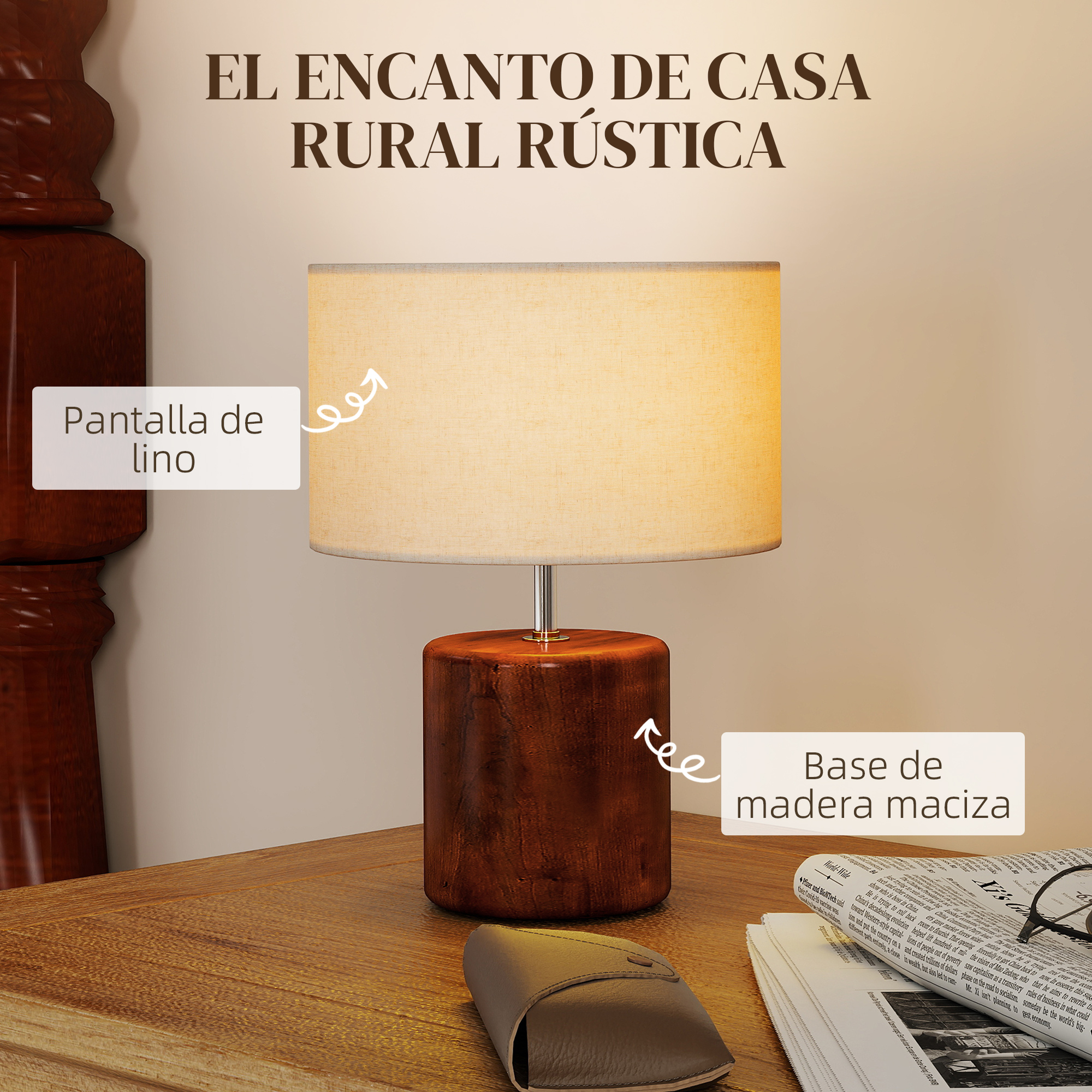 Una mesa con una lámpara de base de madera y pantalla de lino. Periódicos a su lado.