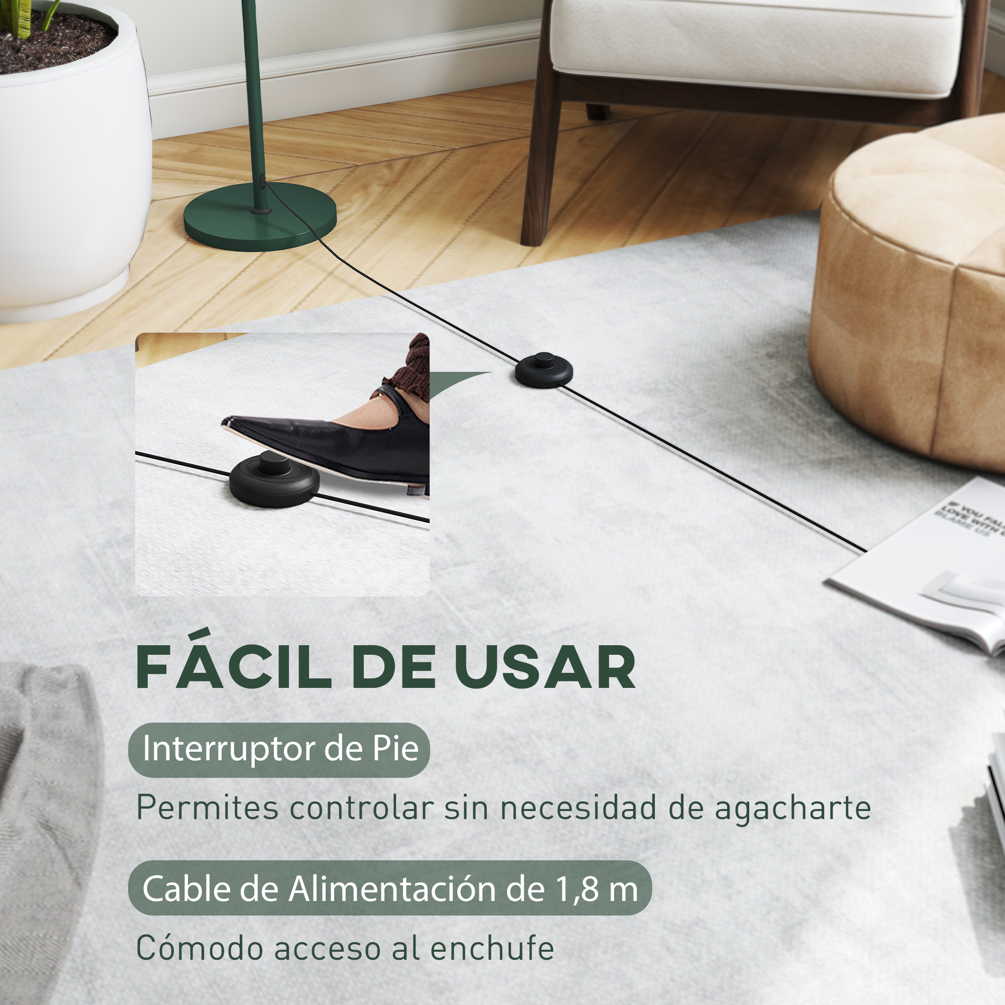 Un interruptor de pie negro con cable sobre una alfombra, cerca de un sillón.