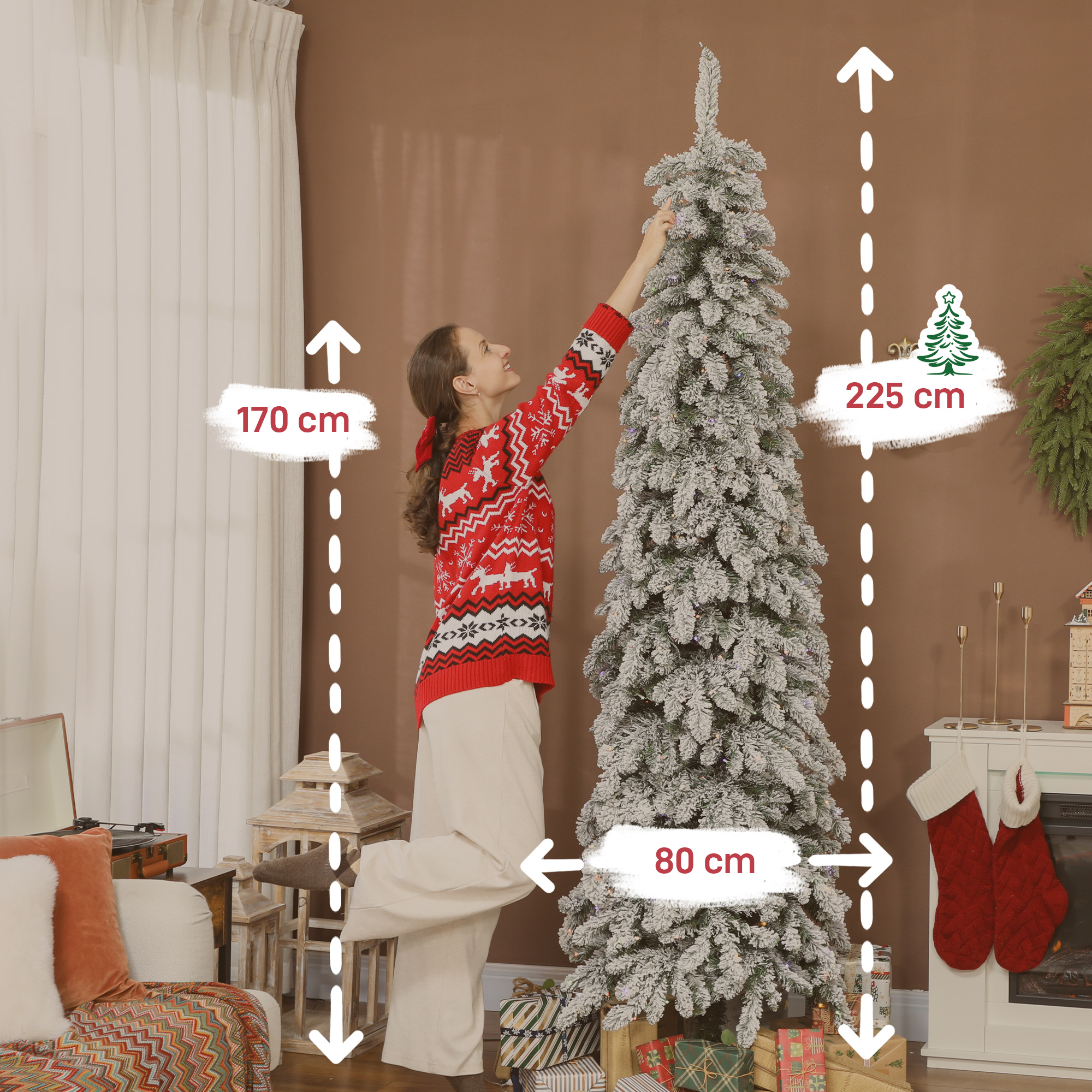 Una mujer decora un árbol de Navidad cubierto de nieve. Se muestran medidas.