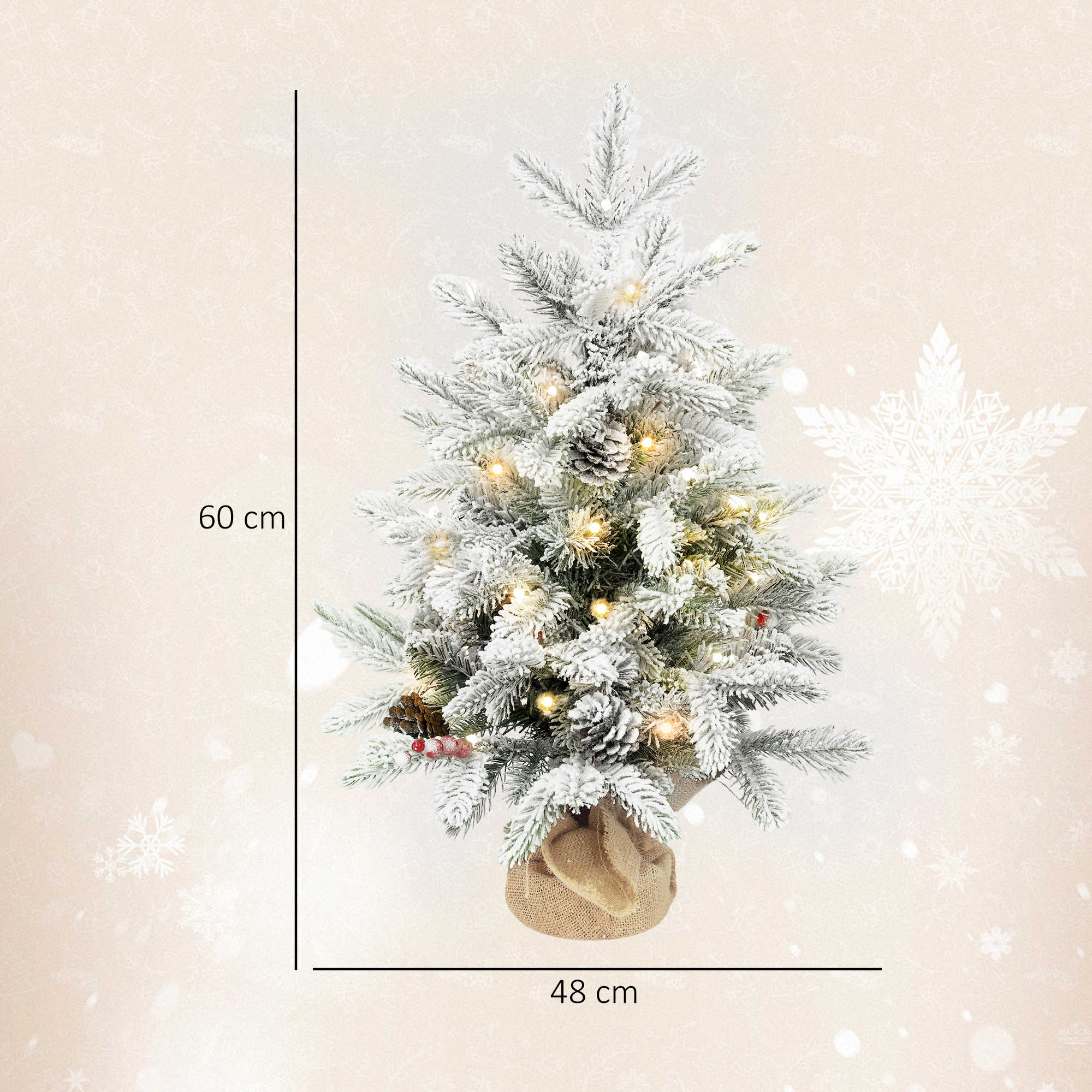 Un árbol de Navidad de 60 cm cubierto de nieve con luces y piñas en base de arpillera.