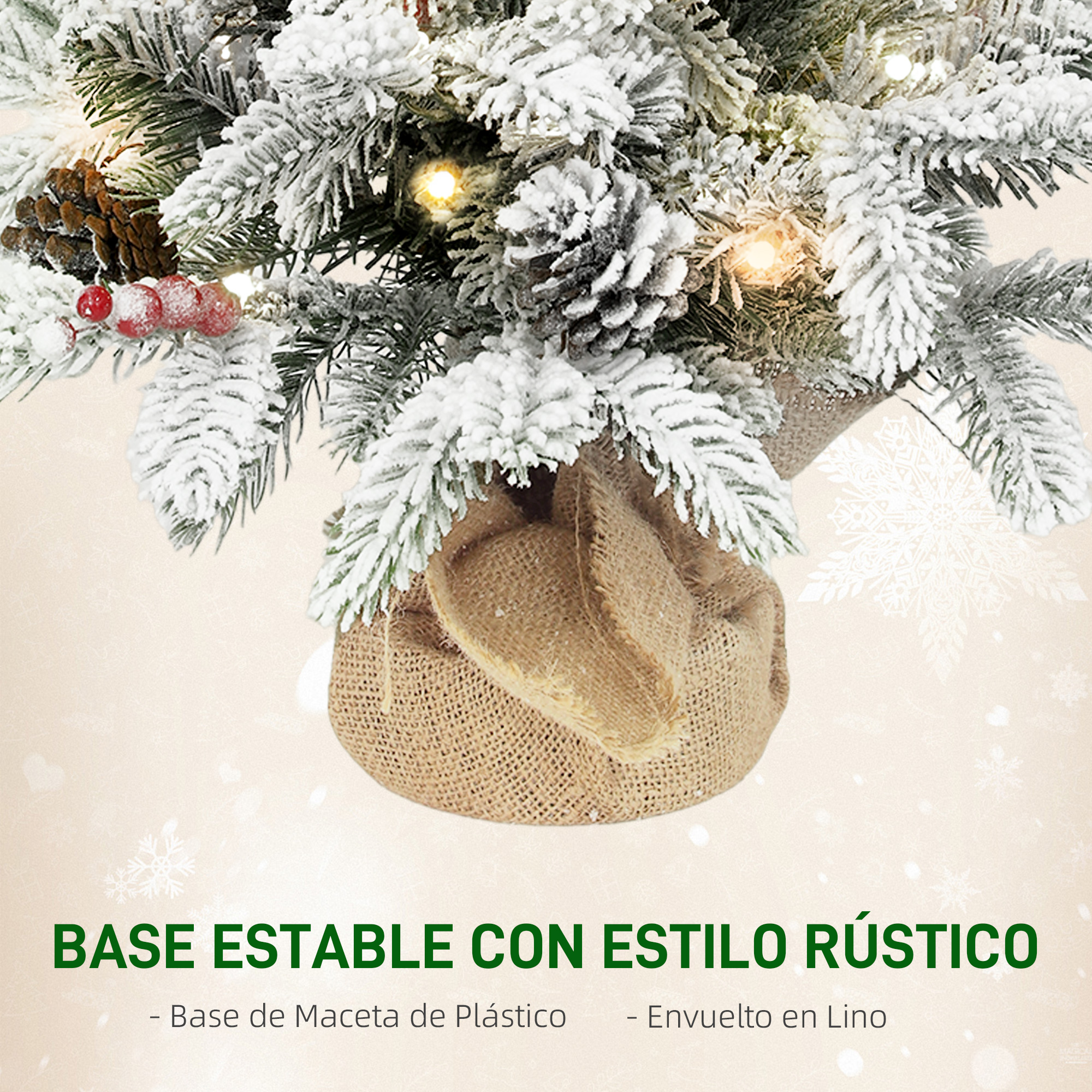 Primer plano de un árbol de Navidad artificial cubierto de nieve con piñas, bayas y luces.