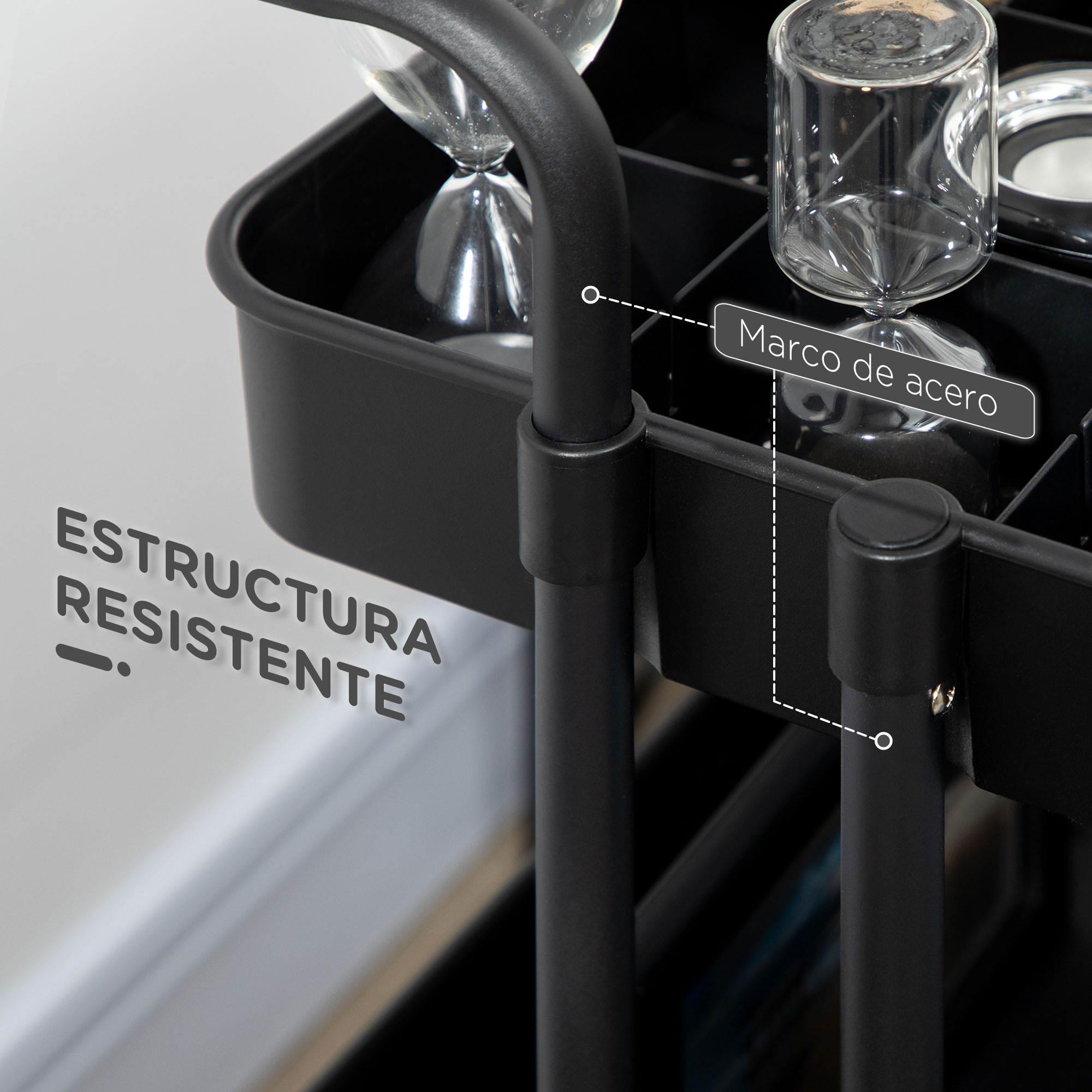 Un carrito metálico negro con recipientes de vidrio y relojes de arena.
