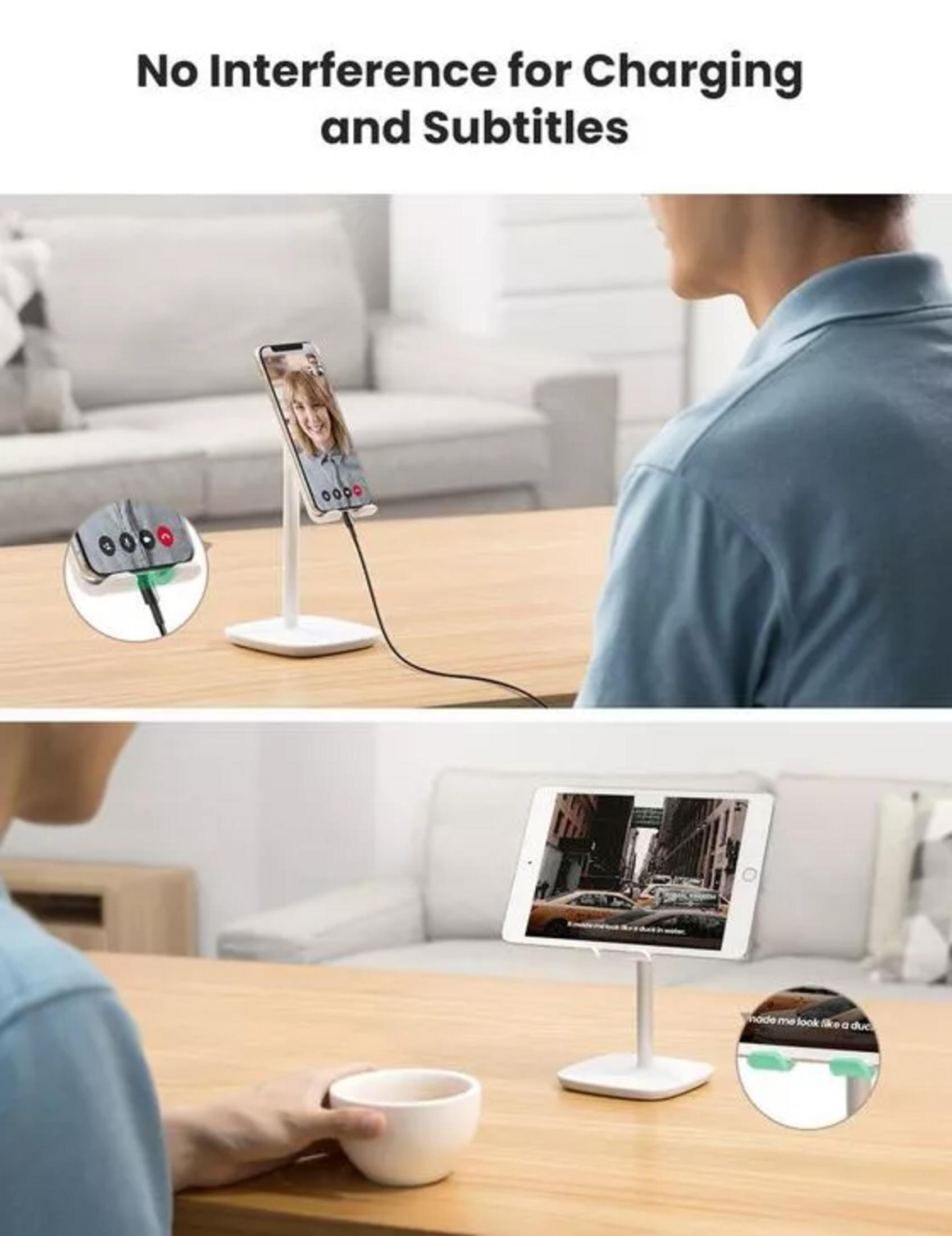 Mężczyzna używa telefonu i tabletu na stojakach. Podłączony jest kabel ładujący.