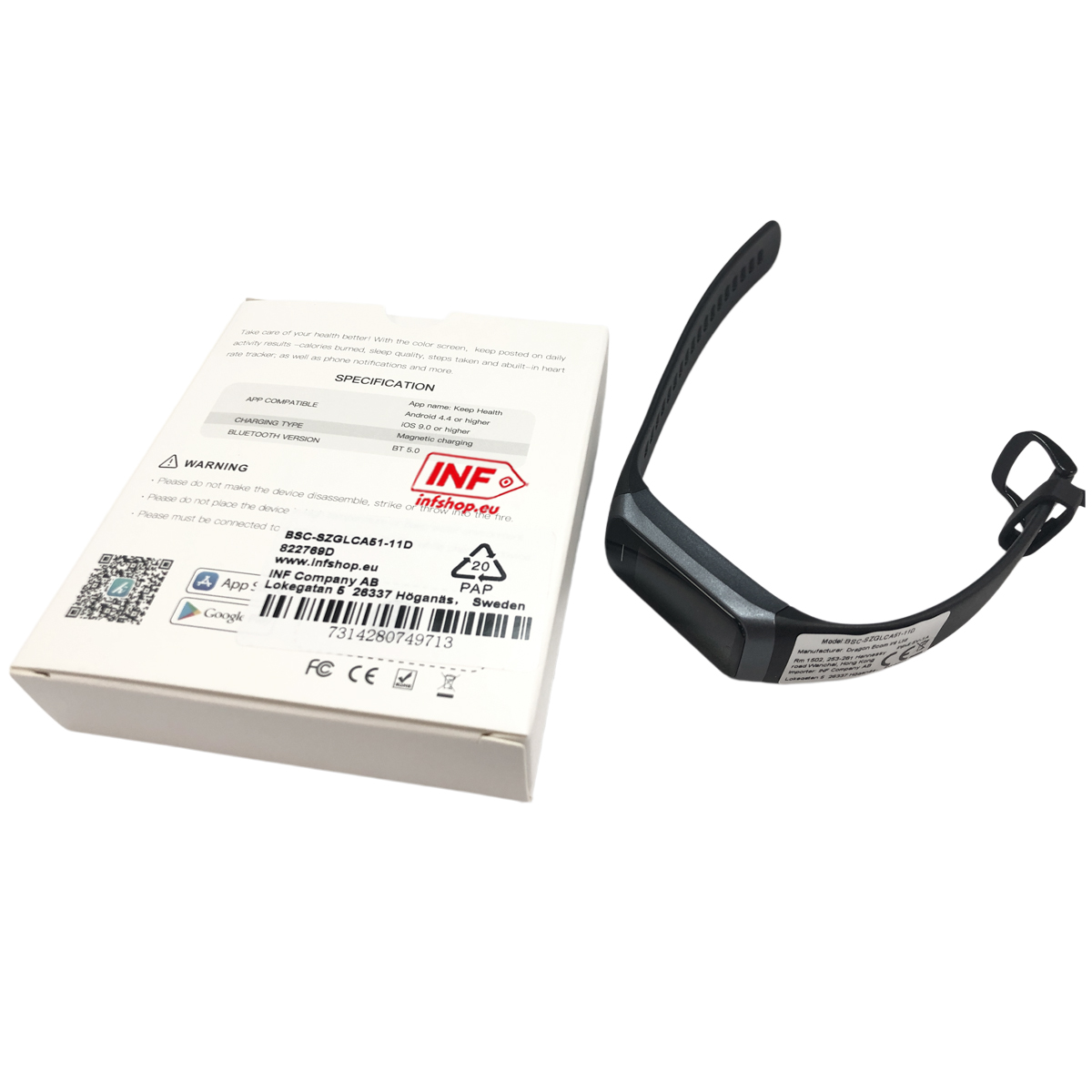 Ein schwarzes Fitnessarmband mit Ladebox liegt neben dem Produktkarton.