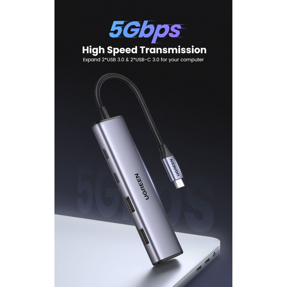 Szary hub USB-C z dwoma portami USB-A i dwoma USB-C.