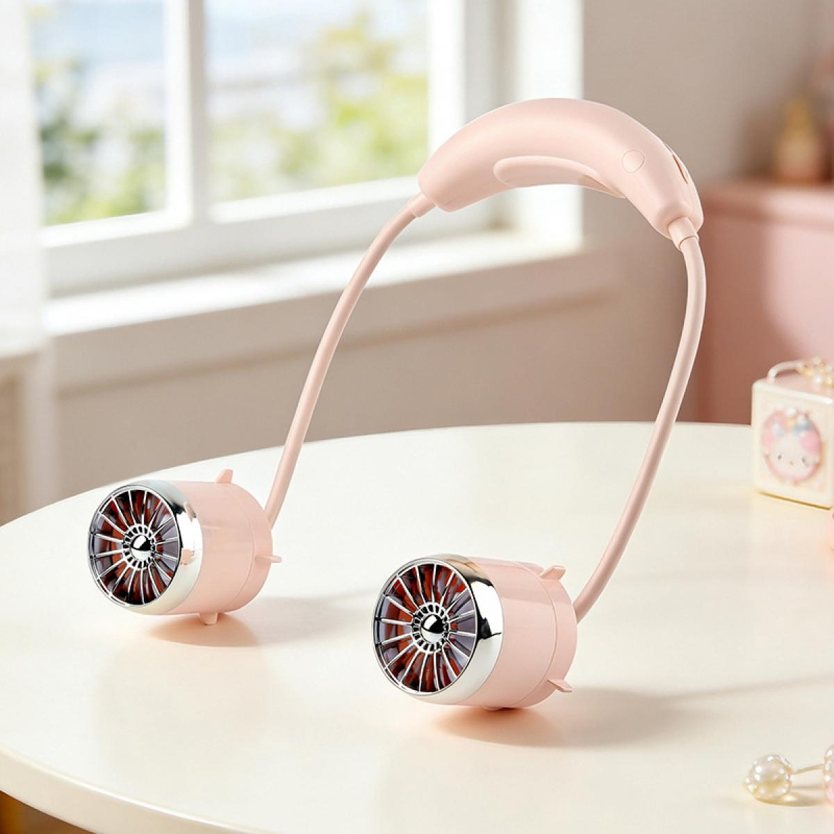 Ein rosafarbener Nackenfächer mit silbernen Akzenten steht auf einem Tisch.