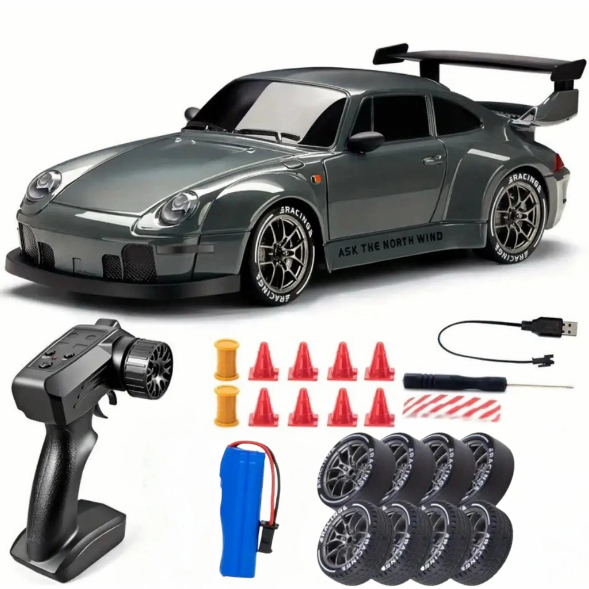 Graues ferngesteuertes Auto mit Zubehör: Fernbedienung, Reifen, Akku, Pylonen.