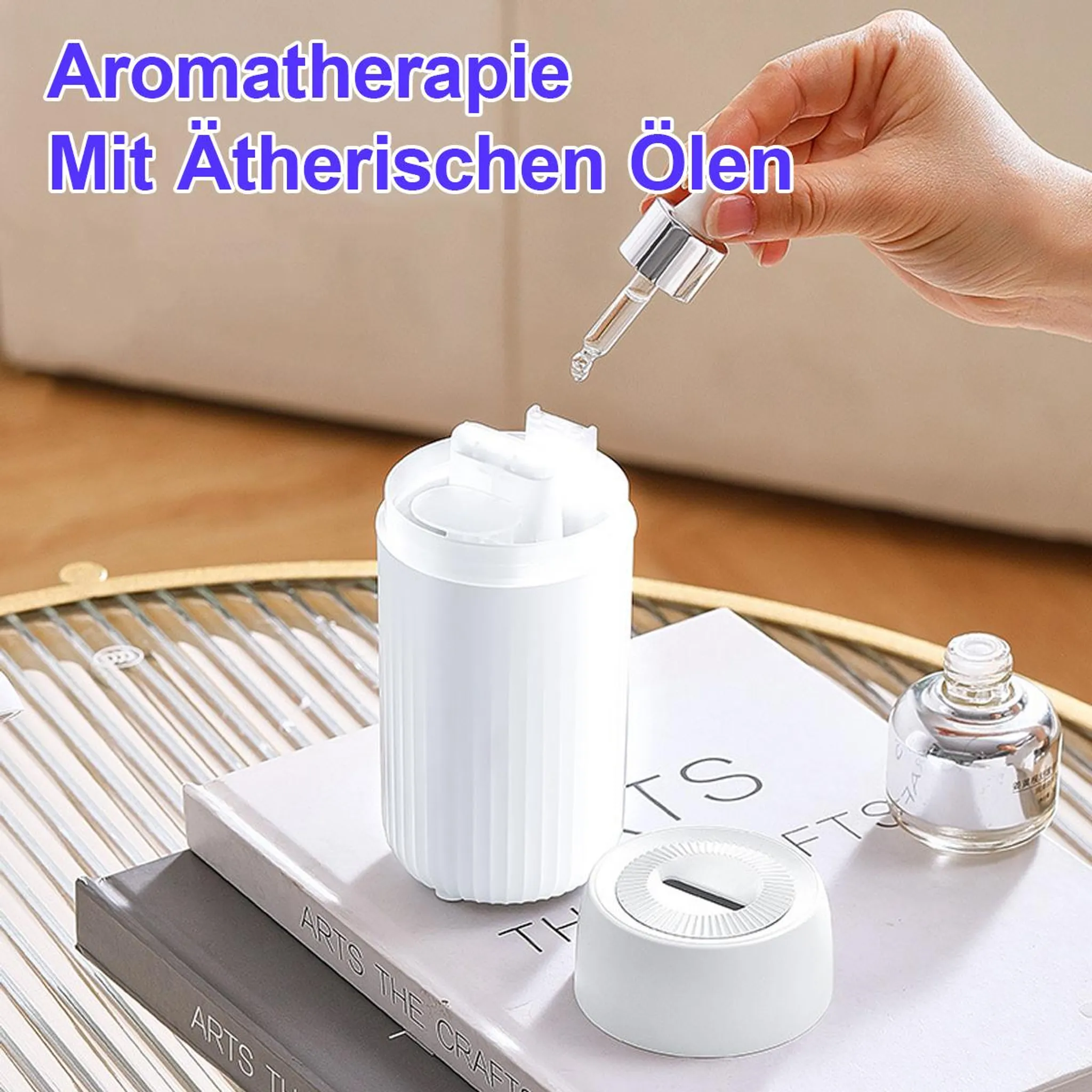 Hand tropft Öl in Diffusor. Aromatherapie mit ätherischen Ölen.