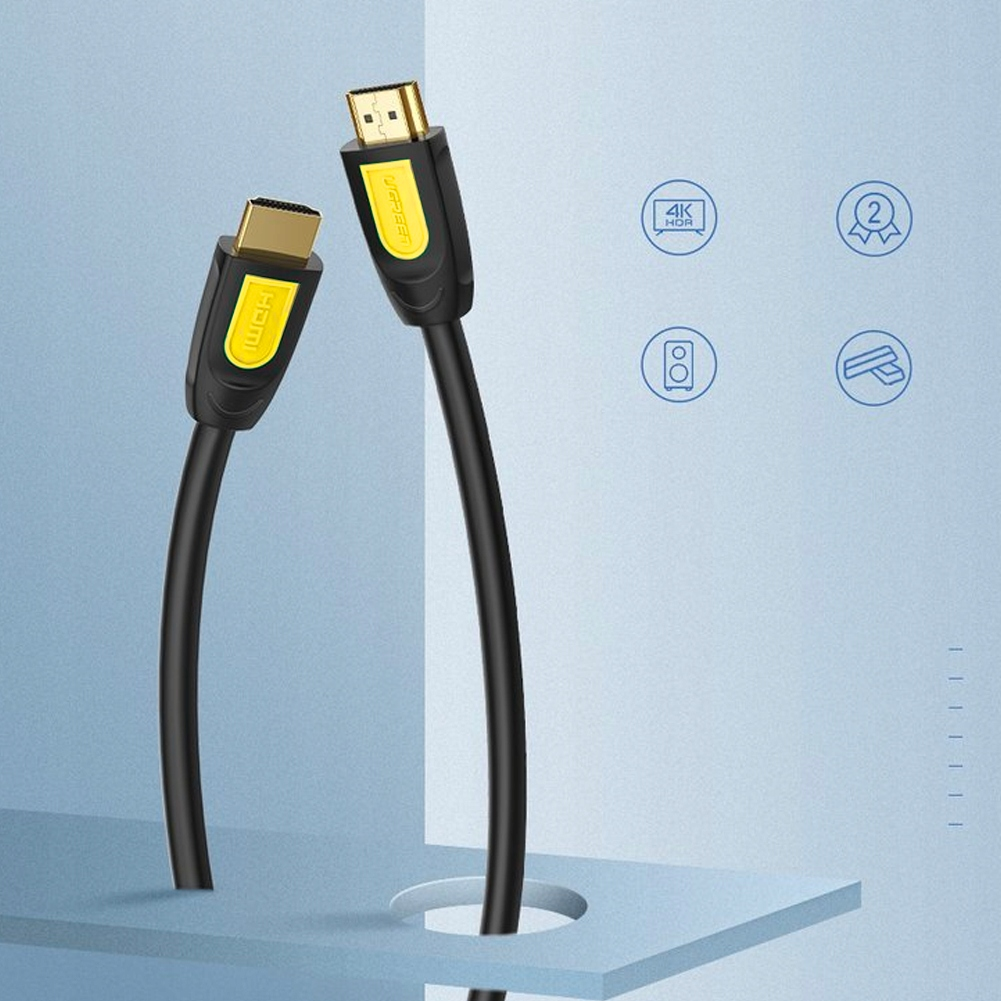 Dwa czarne kable HDMI ze złotymi złączami i żółtymi akcentami na niebieskim tle.