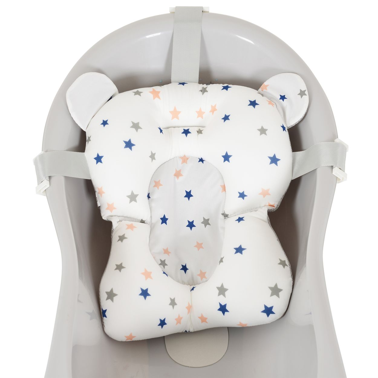 Ein weißer Badesitz für Babys mit Sternenmuster in einer grauen Wanne.