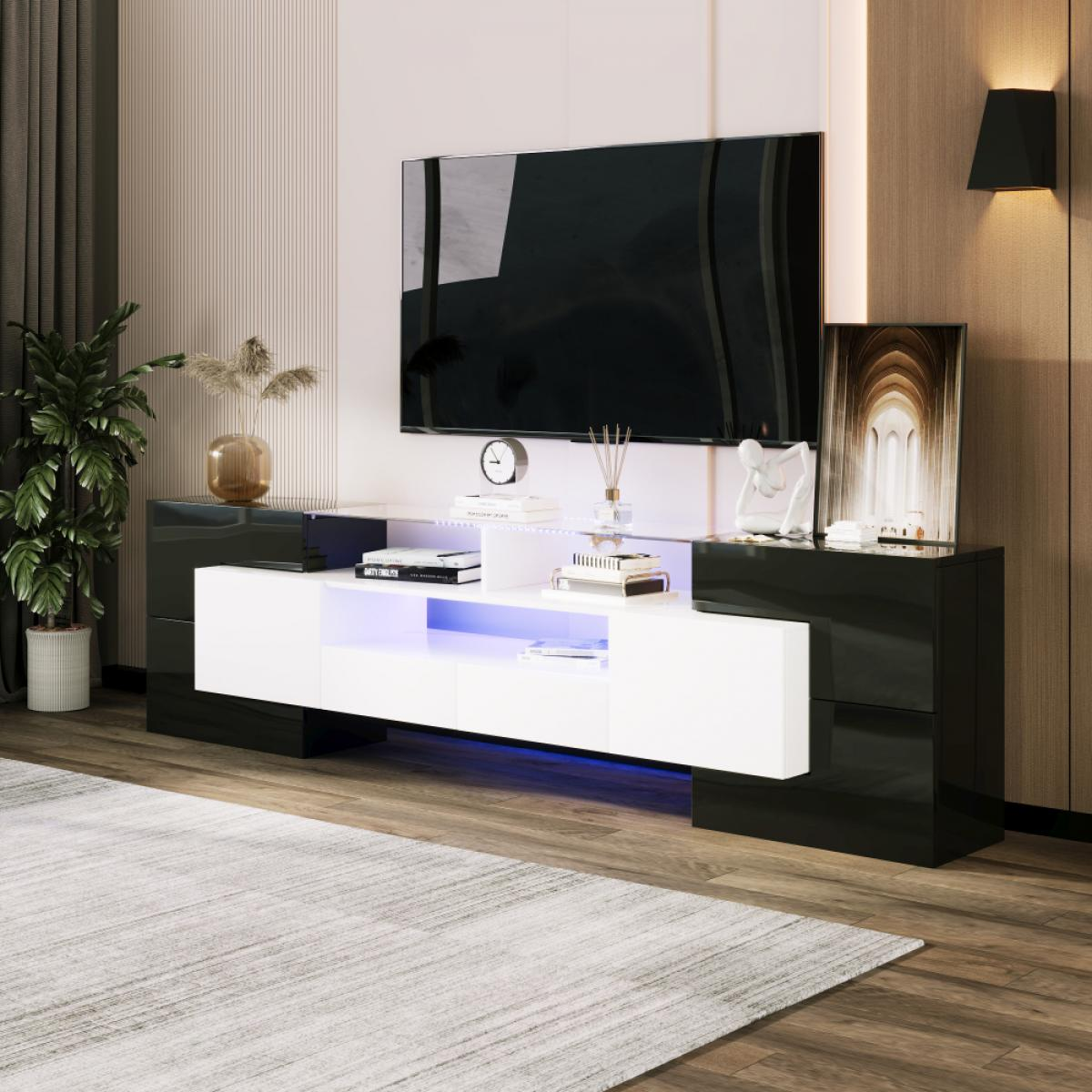 Ein moderner TV-Schrank mit weißer Front und schwarzen Seiten, beleuchtet.