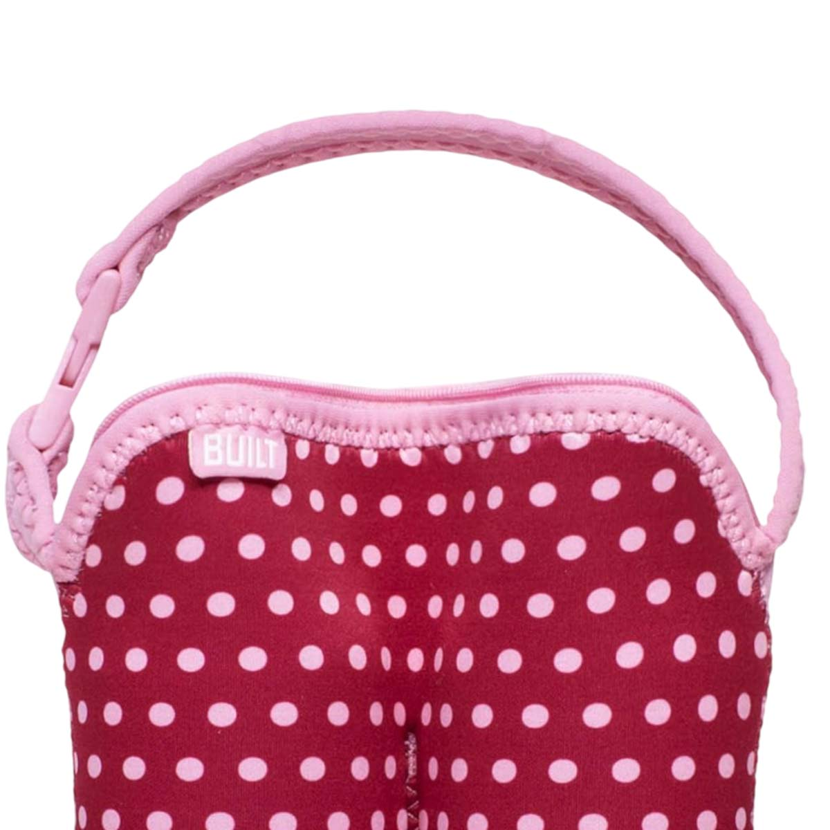 Rote Tasche mit rosa Punkten und Henkel, Reißverschluss oben.