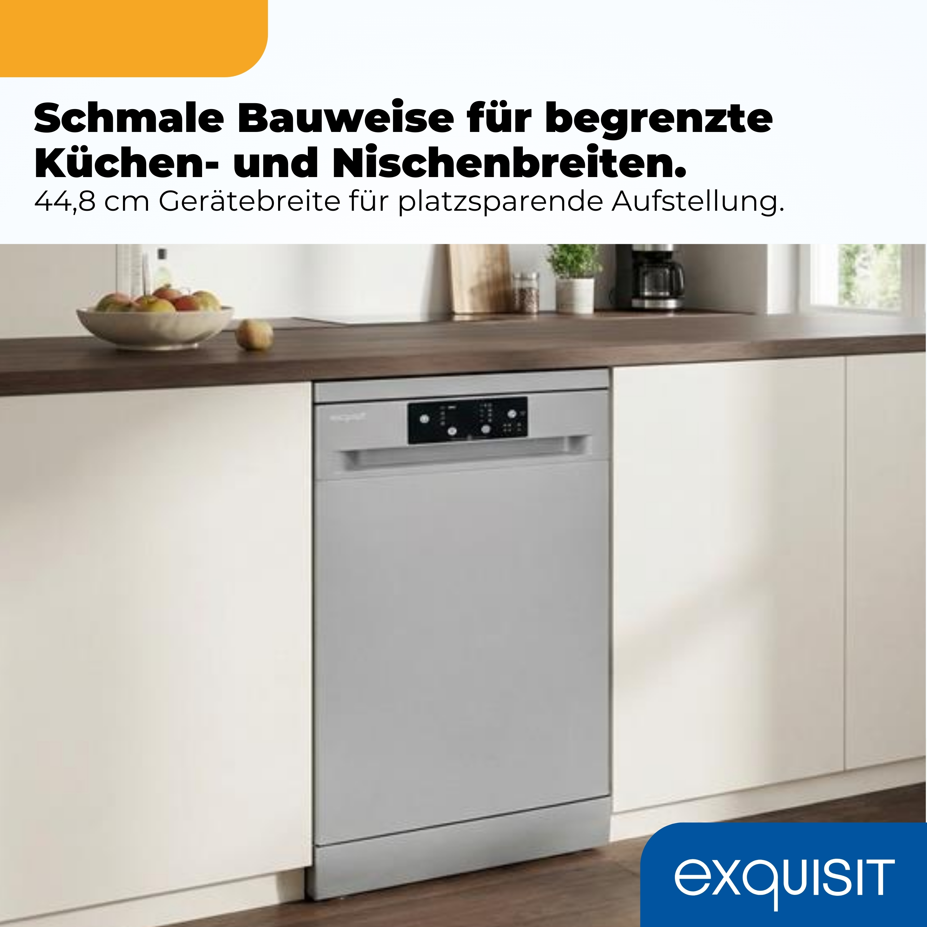 Graue Spülmaschine steht in einer Küche mit Obstschale auf der Arbeitsplatte.