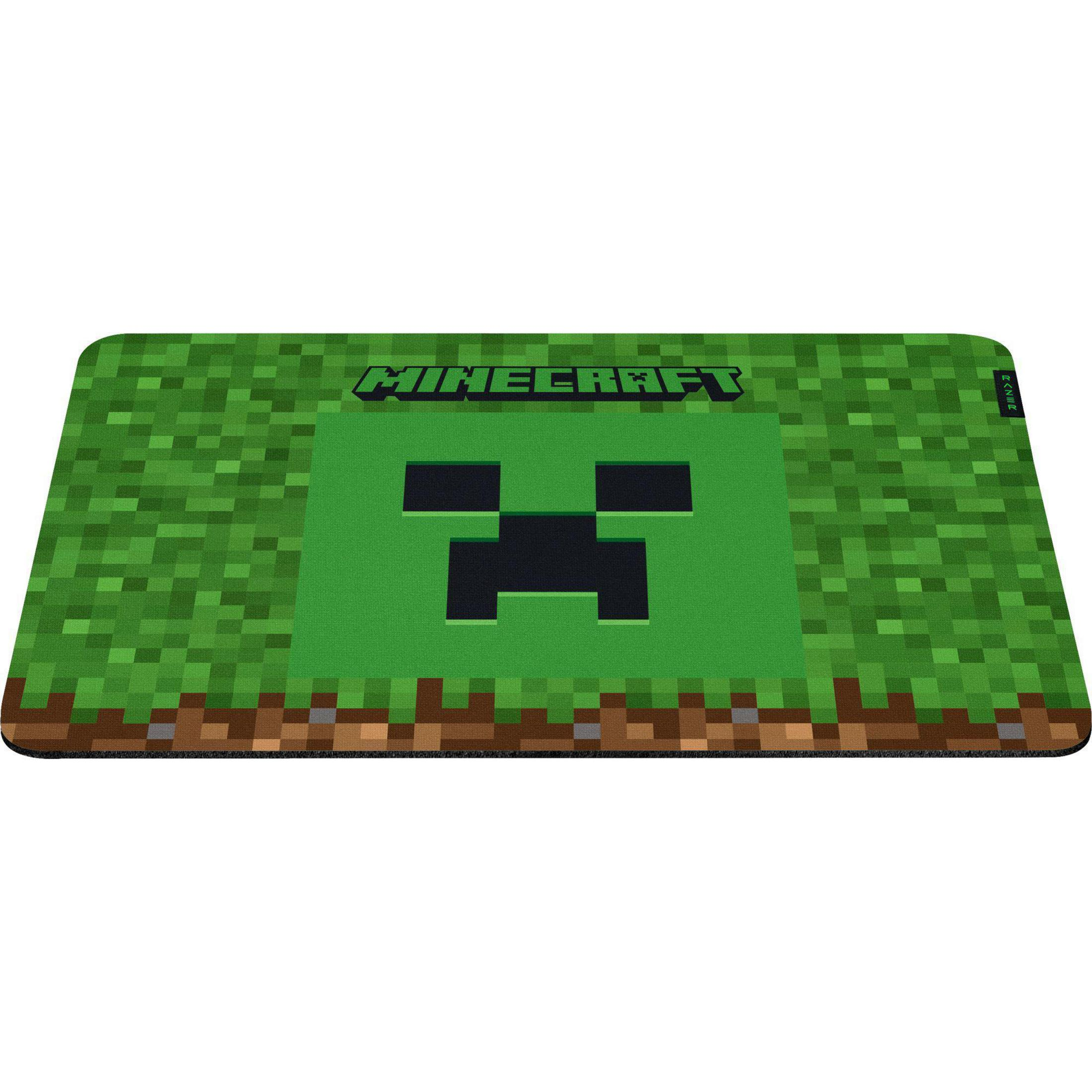 Alfombrilla de ratón de Minecraft con cara de Creeper sobre hierba y tierra.