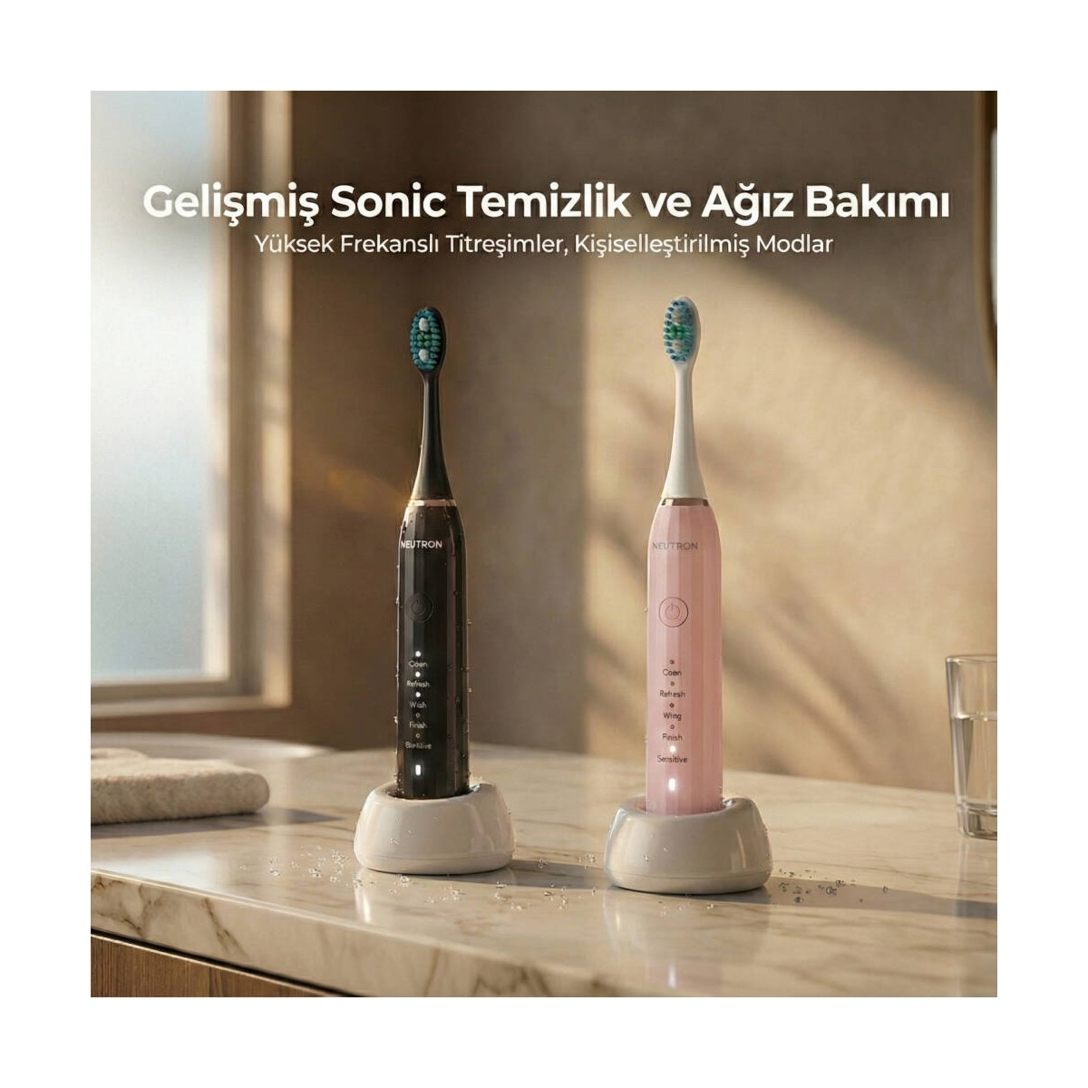 Siyah ve pembe iki Neutron sonik diş fırçası mermer tezgahta duruyor.