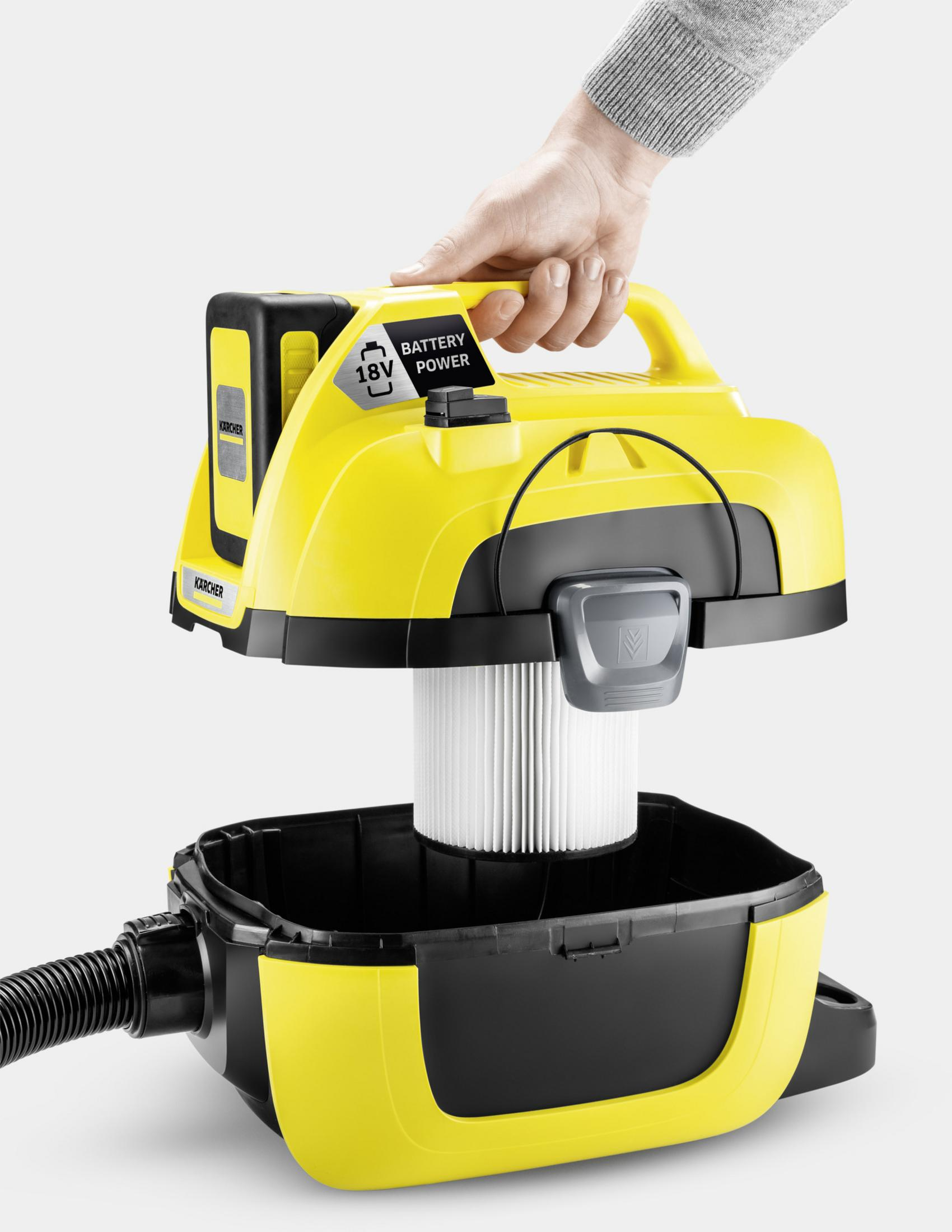 Aspiradora Kärcher amarilla a batería desmontada para mostrar el filtro.