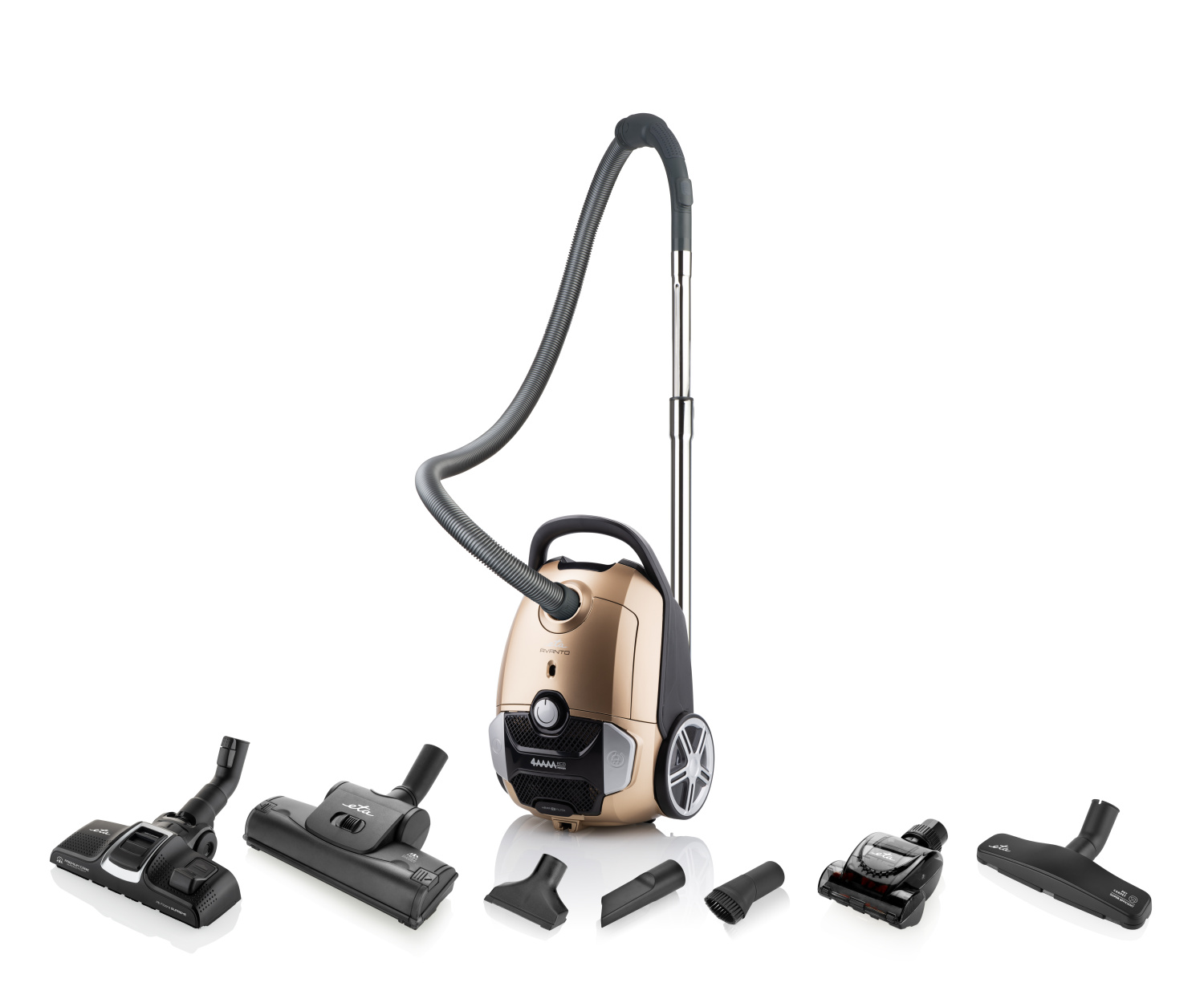 Un aspirateur doré avec tuyau et accessoires sur fond blanc.