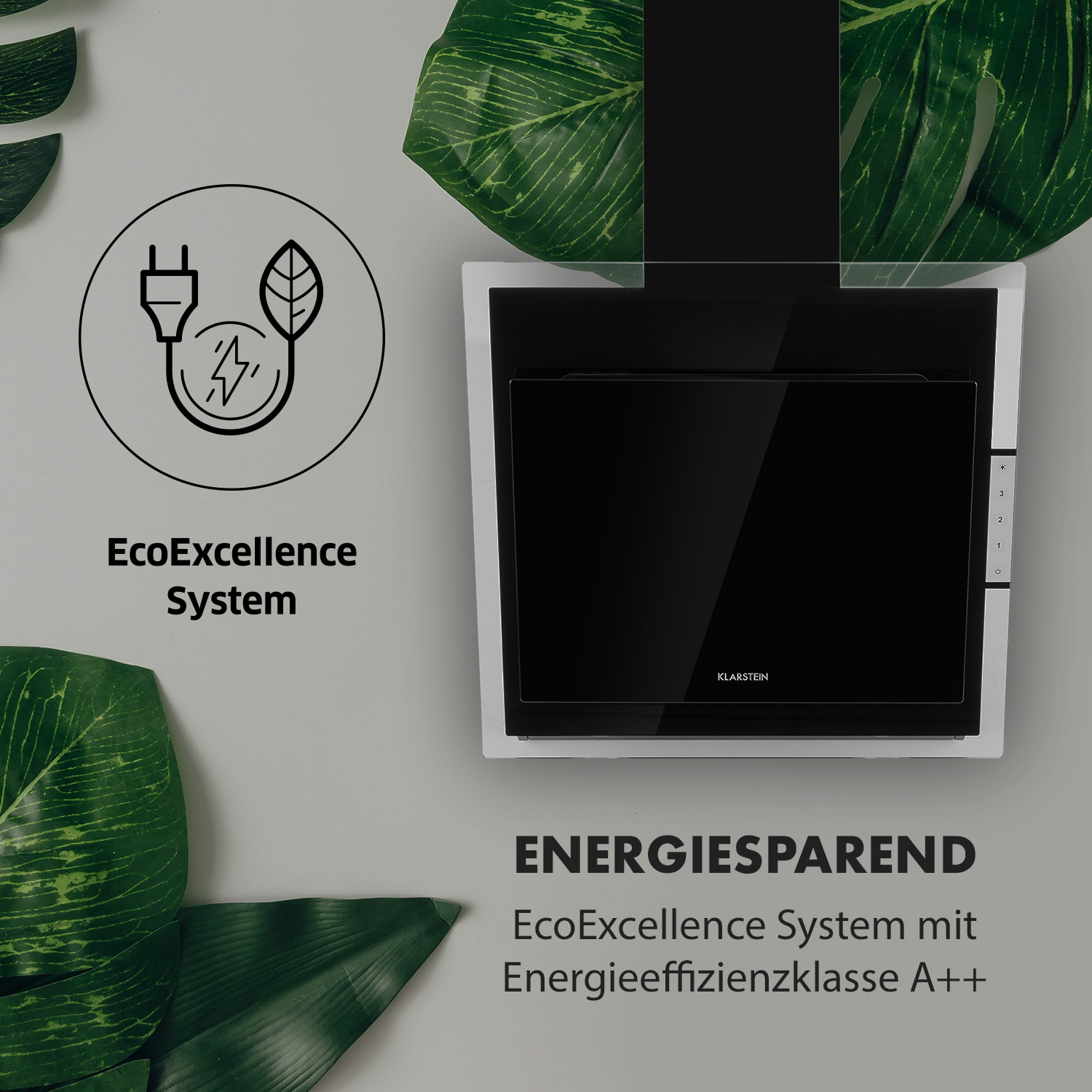 Ein moderner Dunstabzugshaube mit Energiespar-Symbol und grünen Blättern.