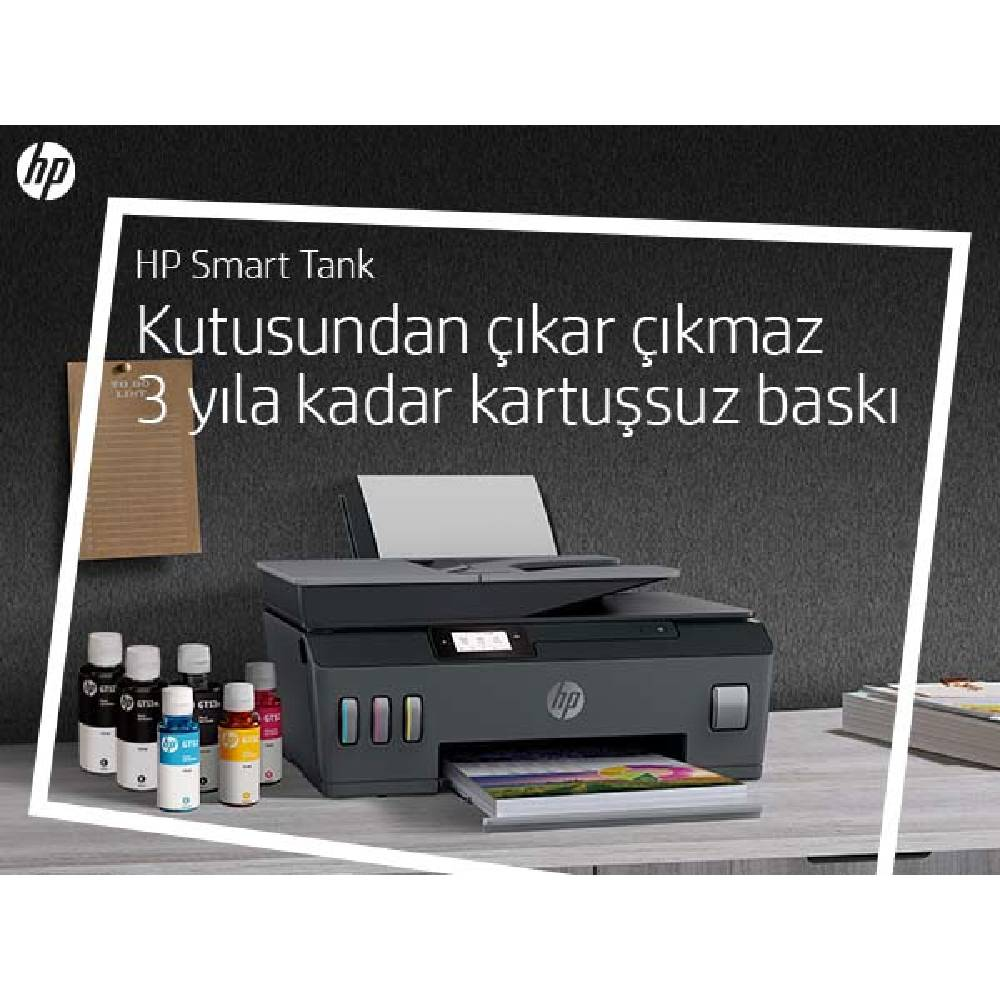 Yanında mürekkep şişeleri bulunan HP Smart Tank yazıcı.