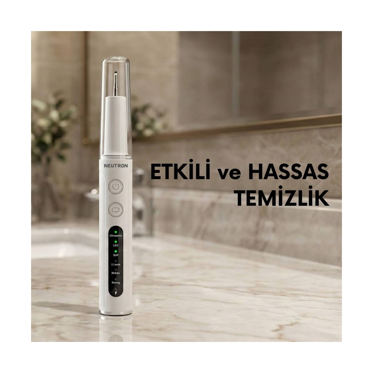 Mermer üzerinde LED göstergeleri ve düğmeleri olan beyaz diş temizleme aleti.