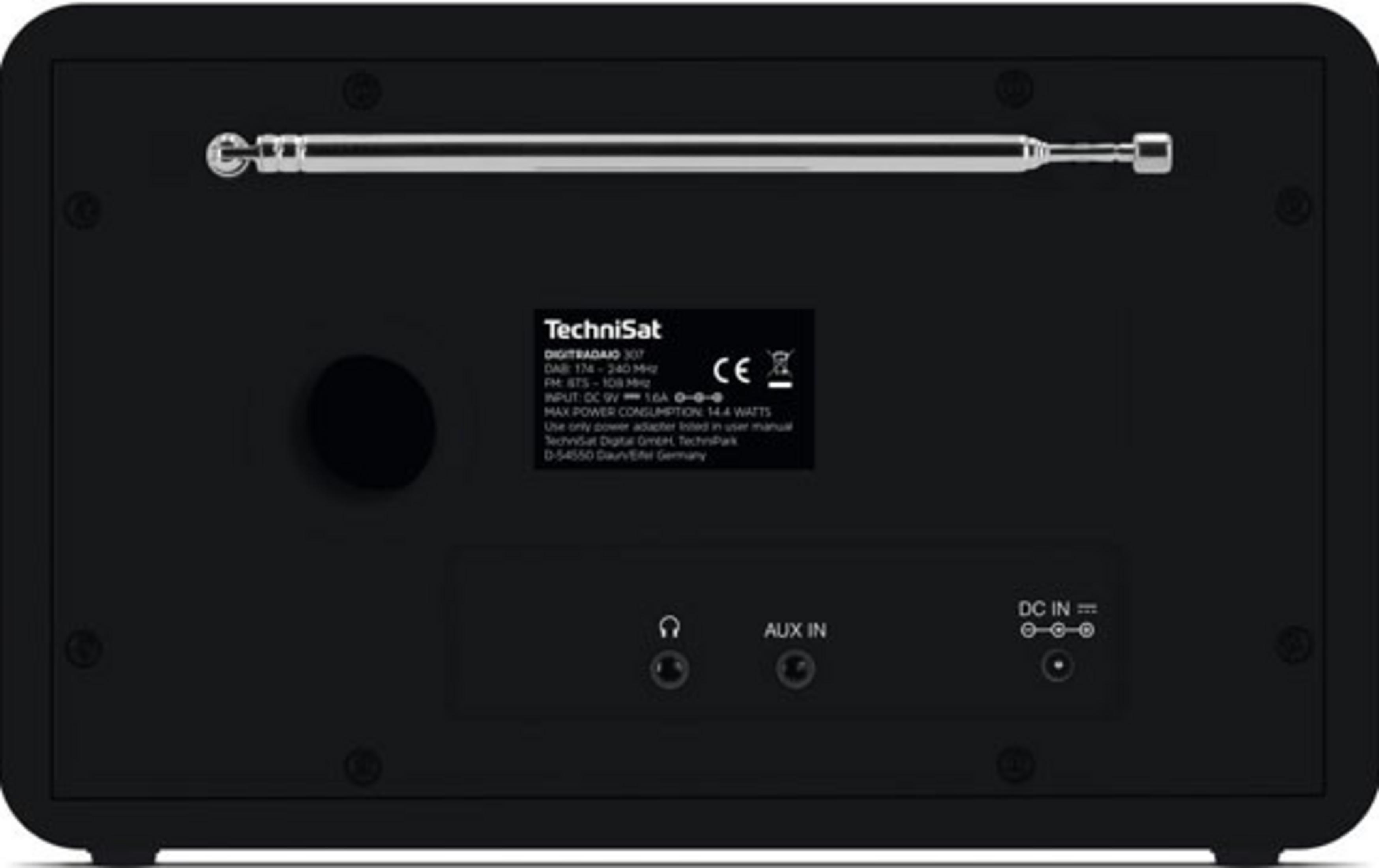 Achterkant van een zwarte radio met uitschuifbare antenne, poorten en technische details.