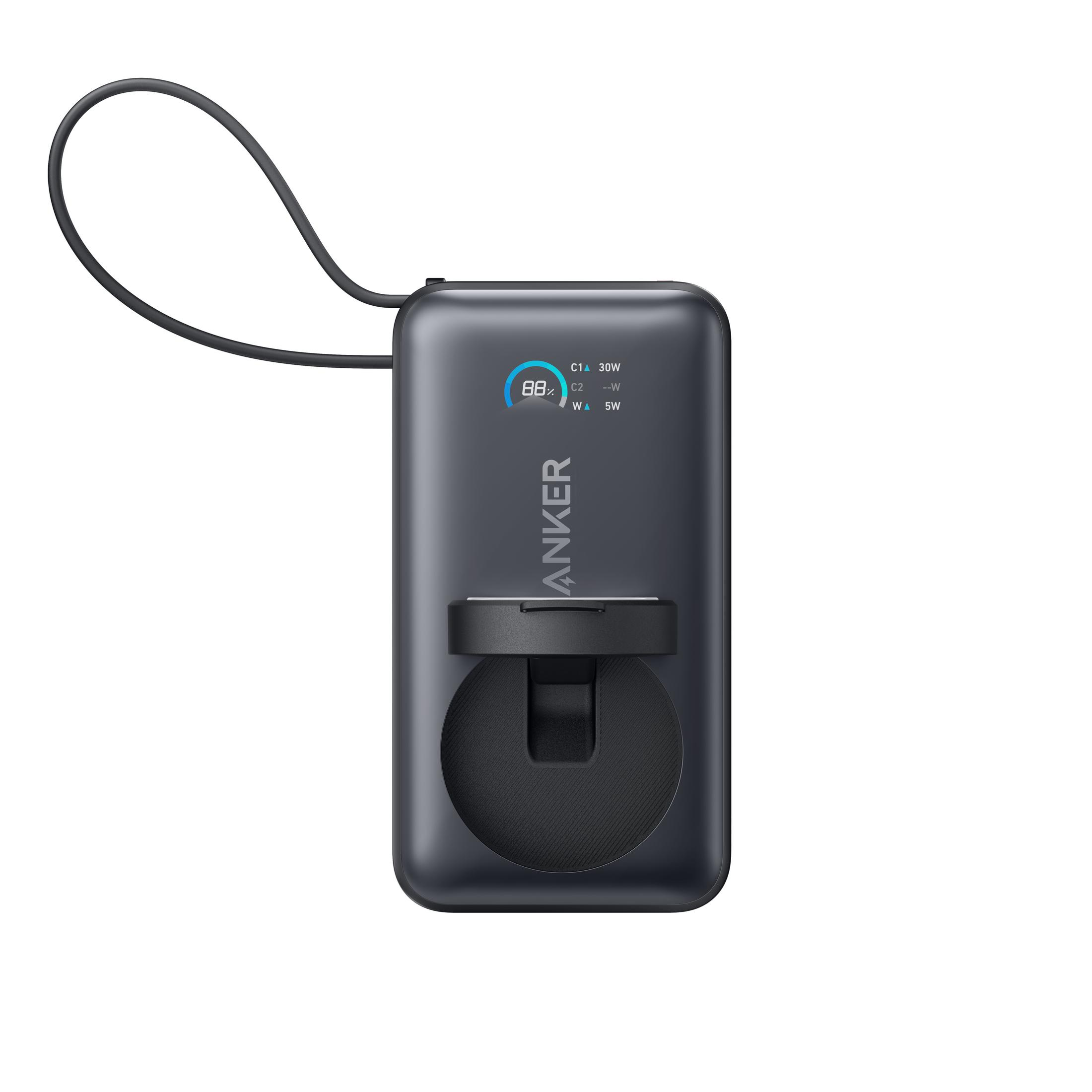 Ciemny power bank Anker ze wskaźnikiem naładowania i uchwytem.