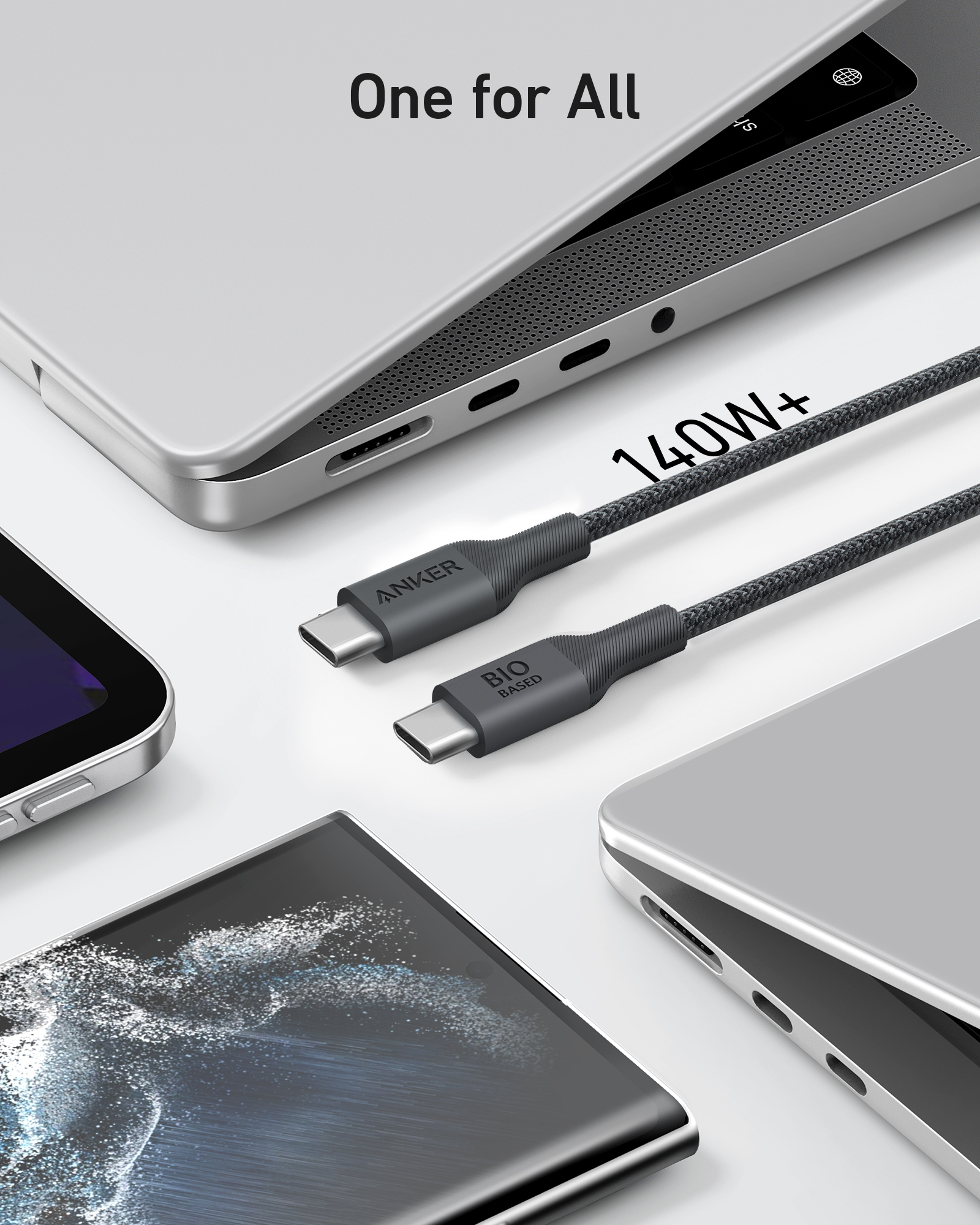 Un cavo USB-C da 140W+ poggia vicino a laptop e smartphone.