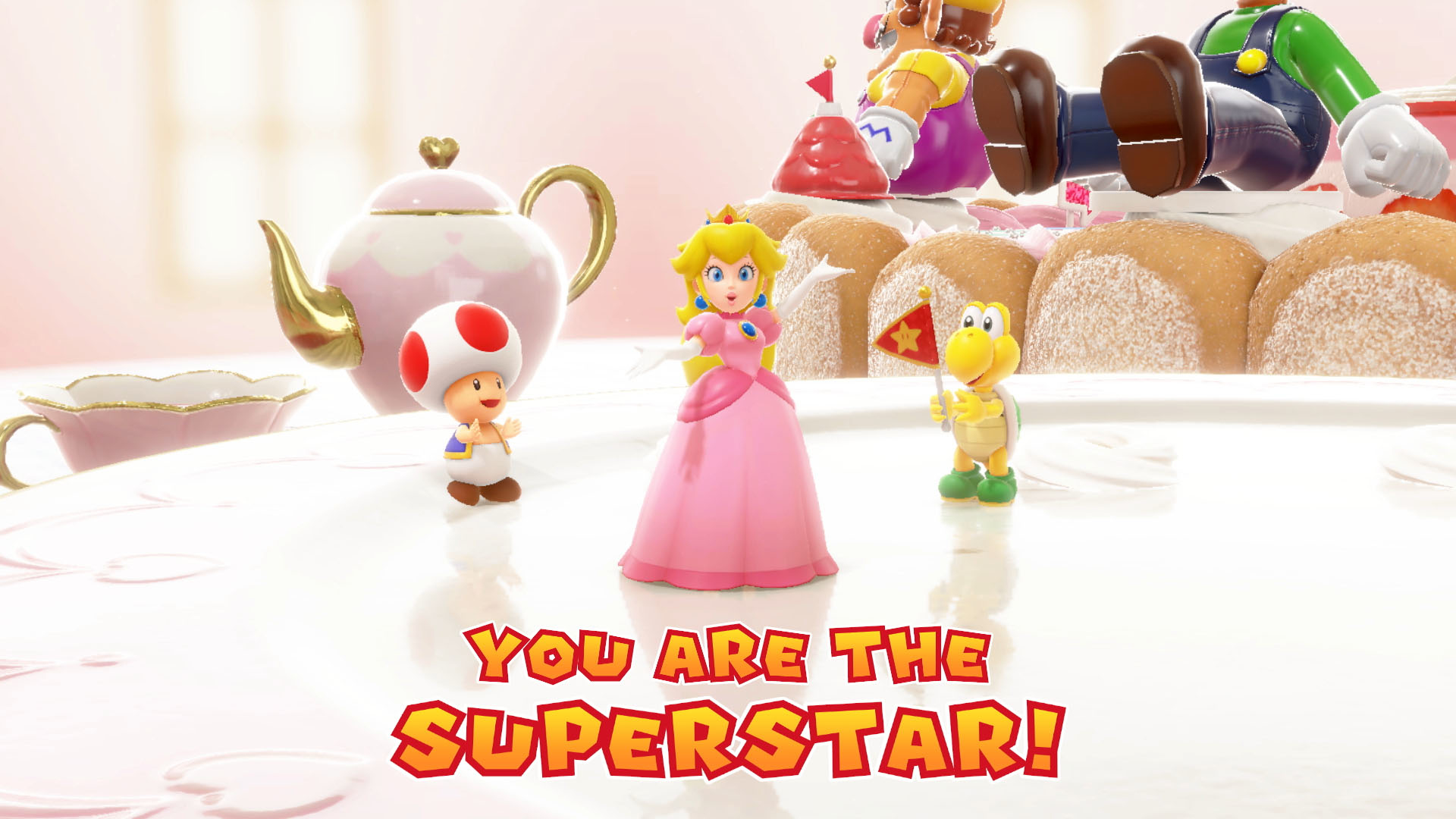 Księżniczka Peach, Toad i Koopa na torcie z napisem "YOU ARE THE SUPERSTAR!"