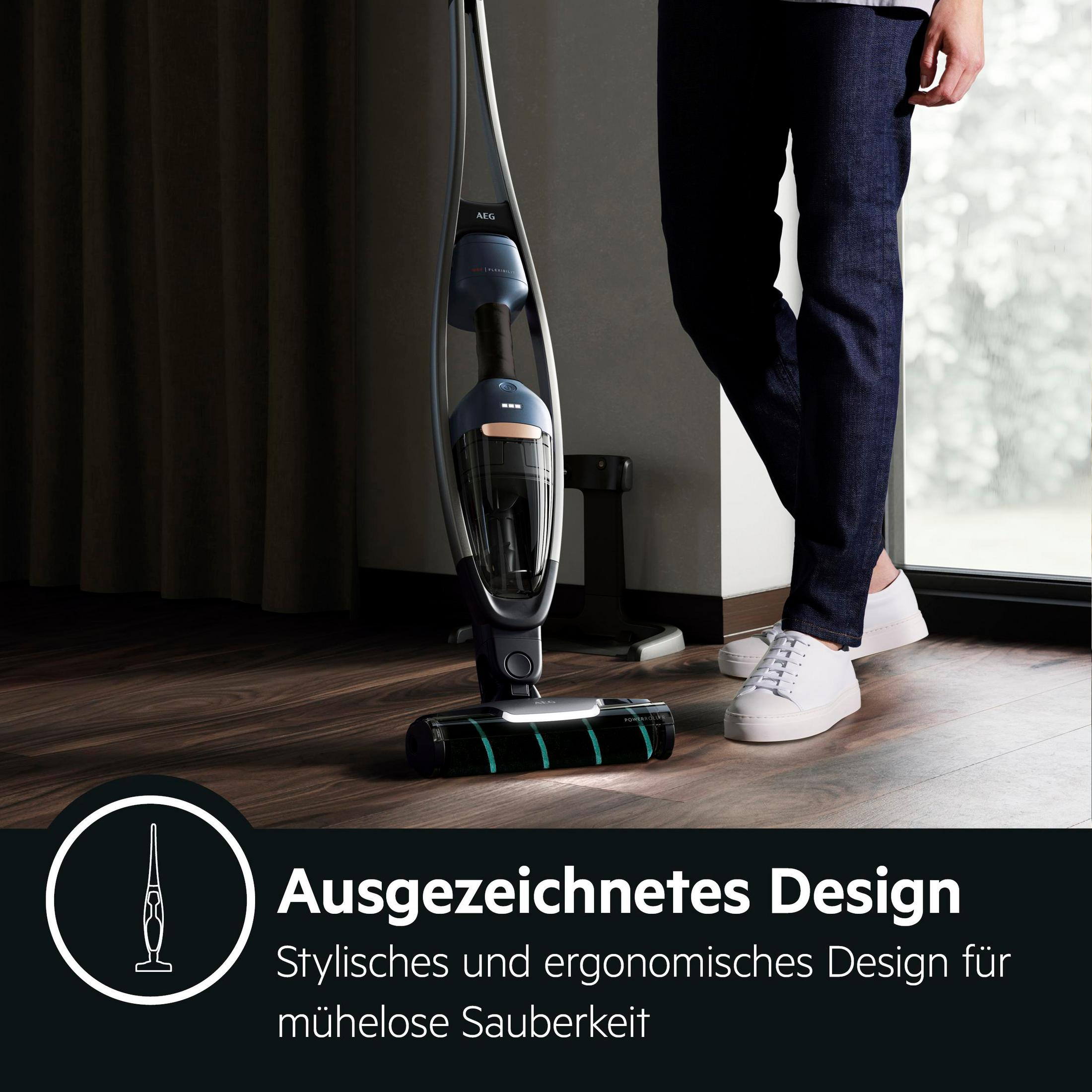 Ein stilvoller Akkusauger steht auf einem Holzboden neben einer Person.